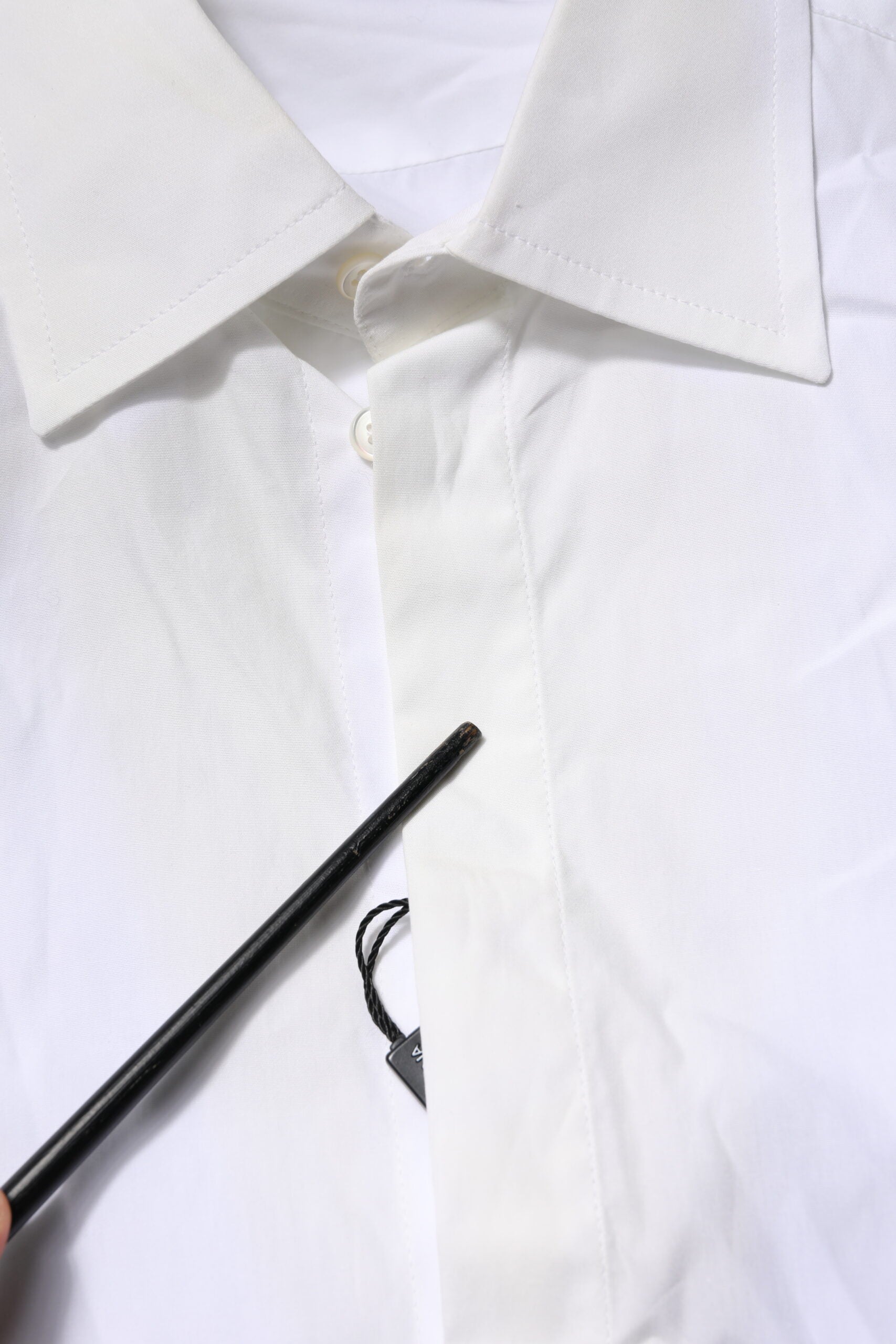 A white cotton dress shirt with a collar and buttons, from the brand Dolce & Gabbana
