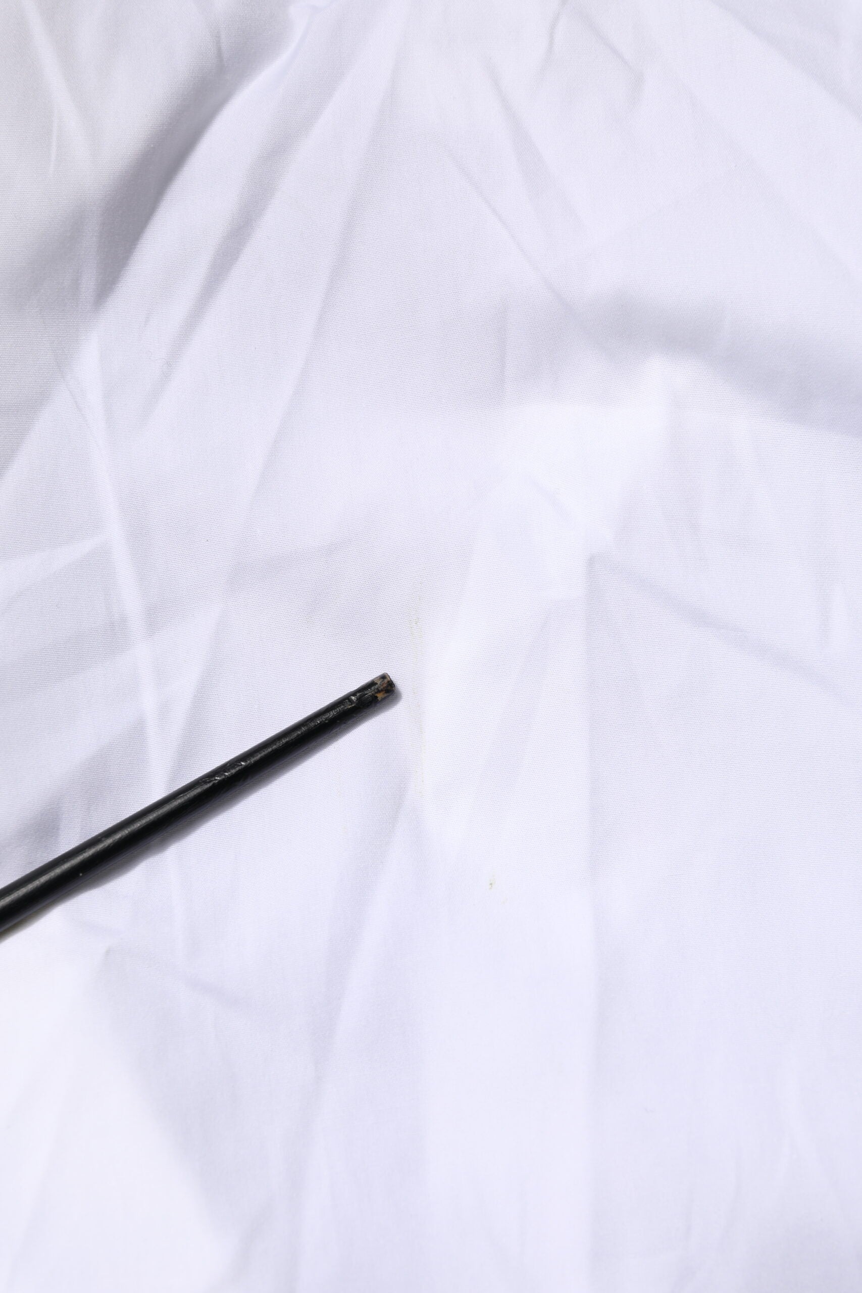 A black tie on a white shirt