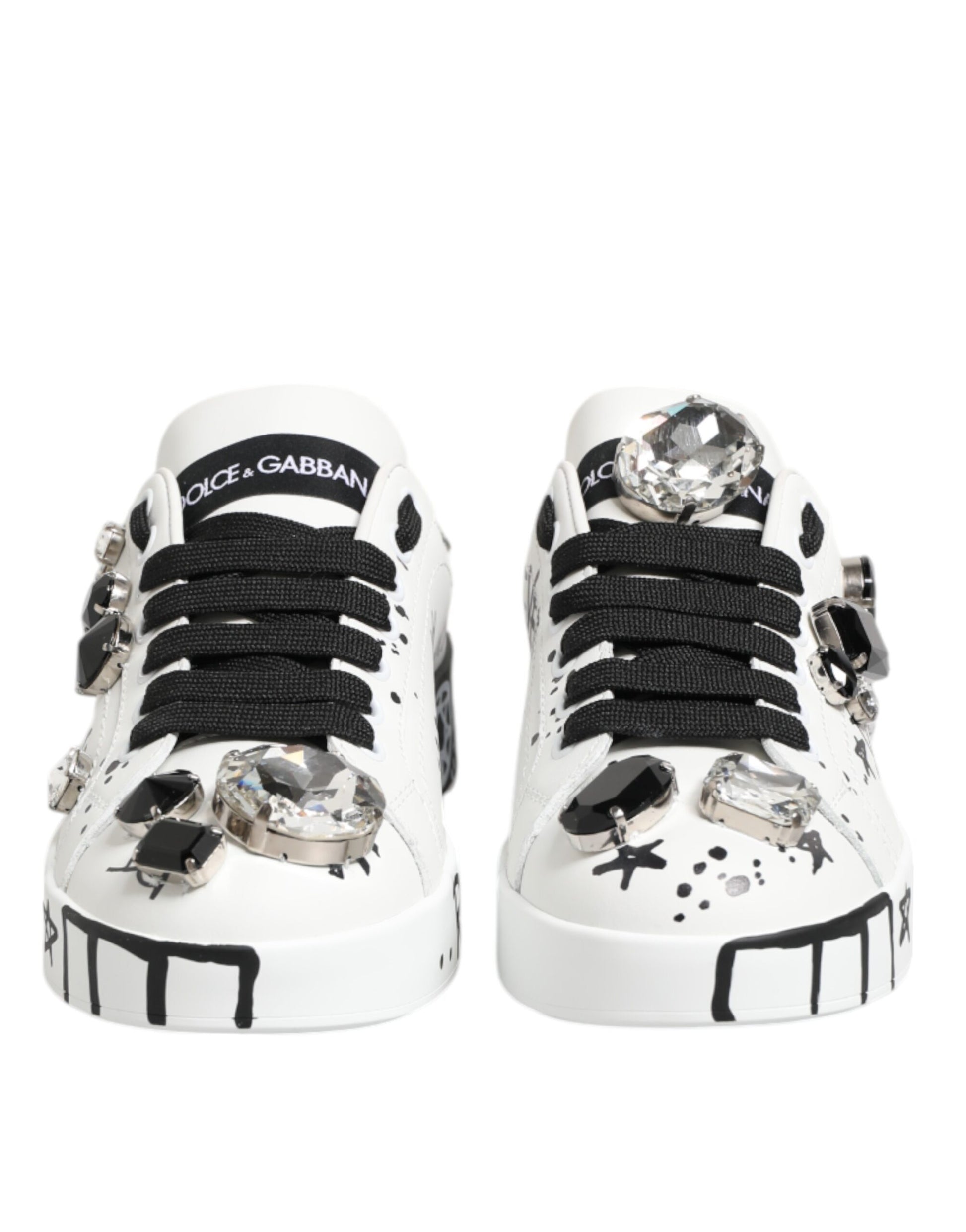 White sneakers with crystals, branded Dolce & Gabbana, featuring a unique design