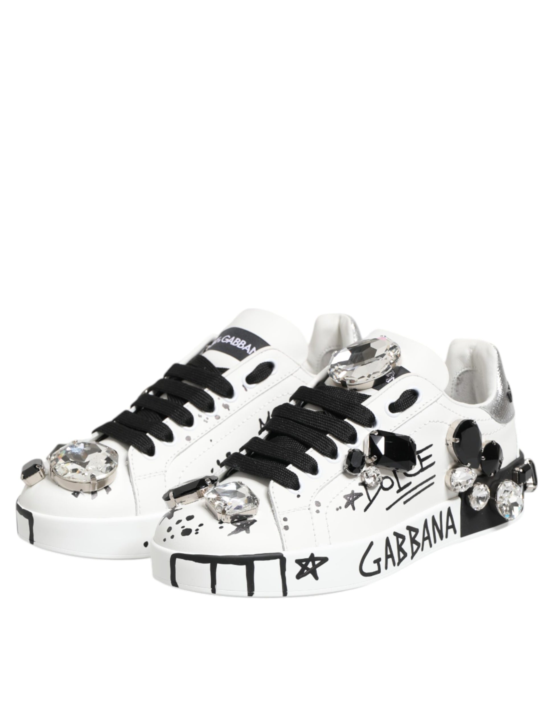 White sneakers with black laces, crystals and stars on the side