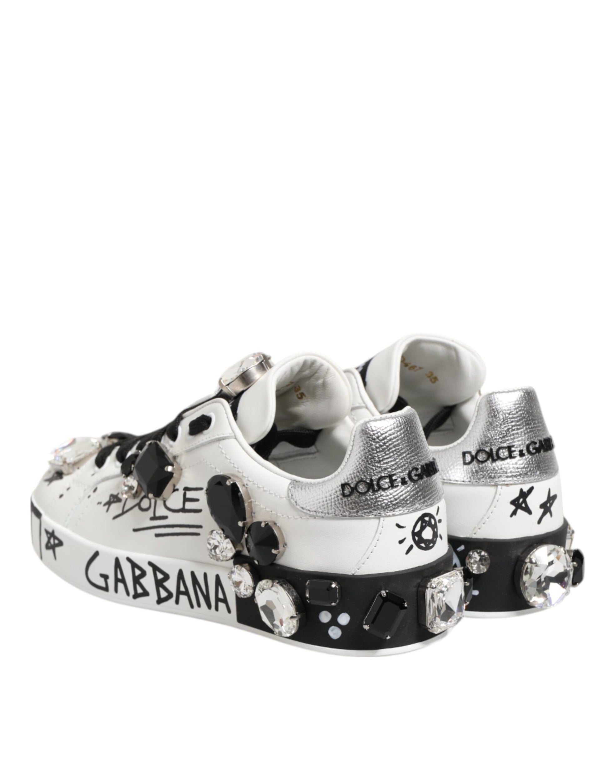 Pair of white sneakers with crystals and stars, featuring the word "Gabanna" on side