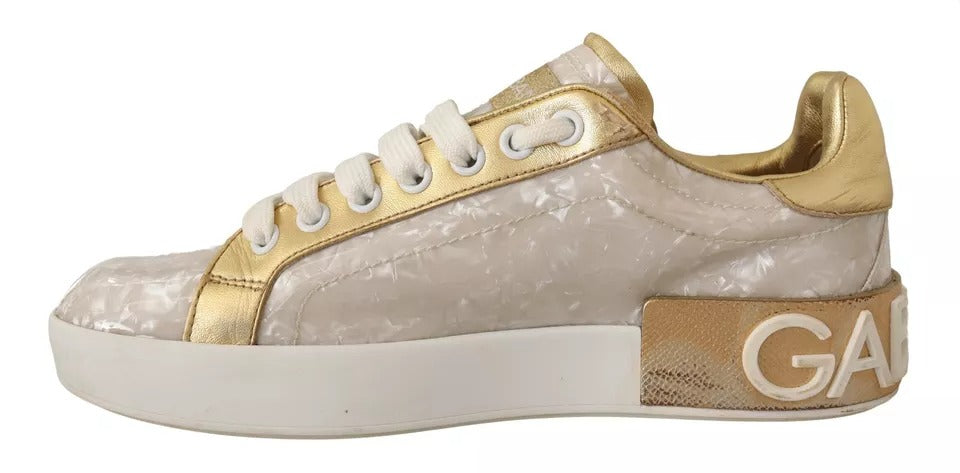 Gold accented sneakers with white laces and mother of pearl design