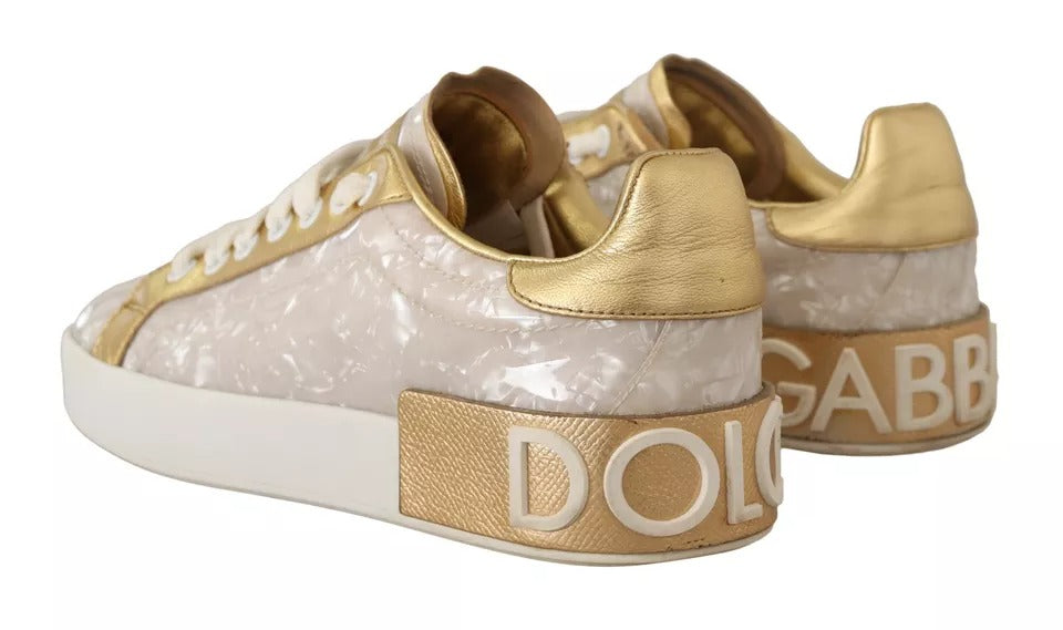 Gold-embellished white sneakers with "Dolce & Gabbana" text