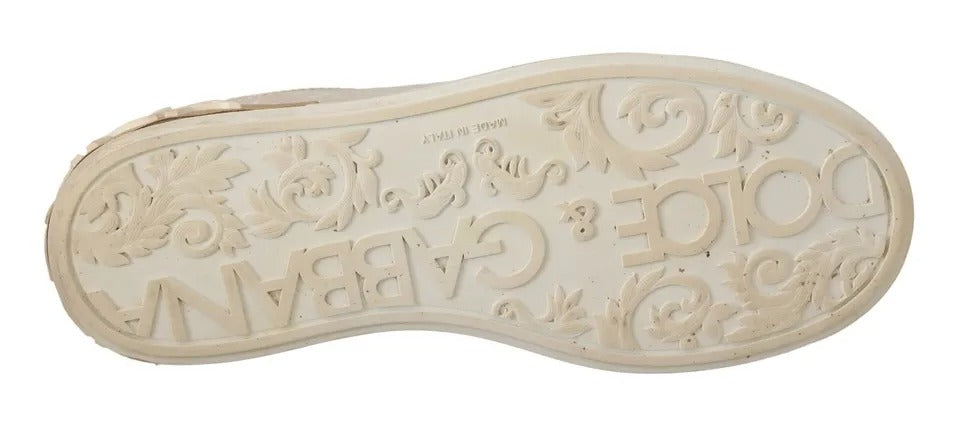 White slip-on shoes with mother of pearl design and text