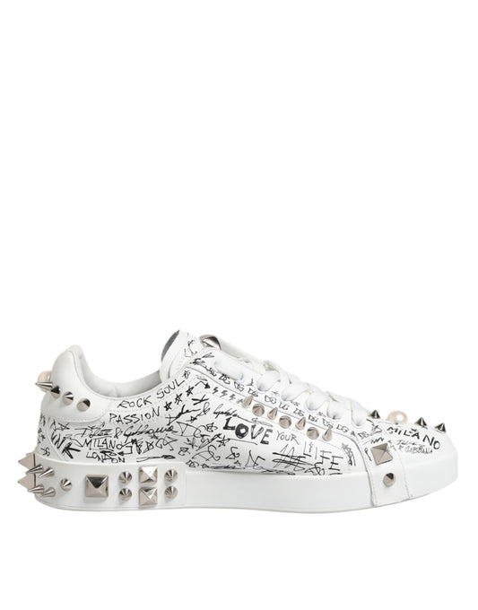 White sneakers with studs, text, and spikes on the side