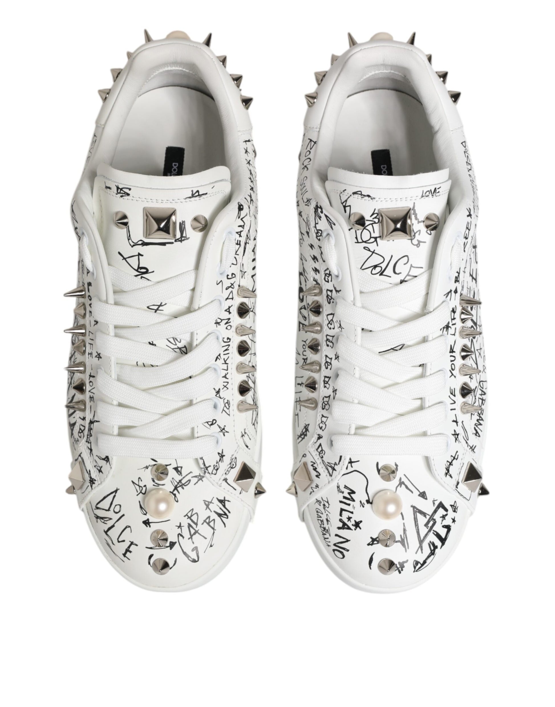 Pair of white sneakers with studs, autographed by various celebrities