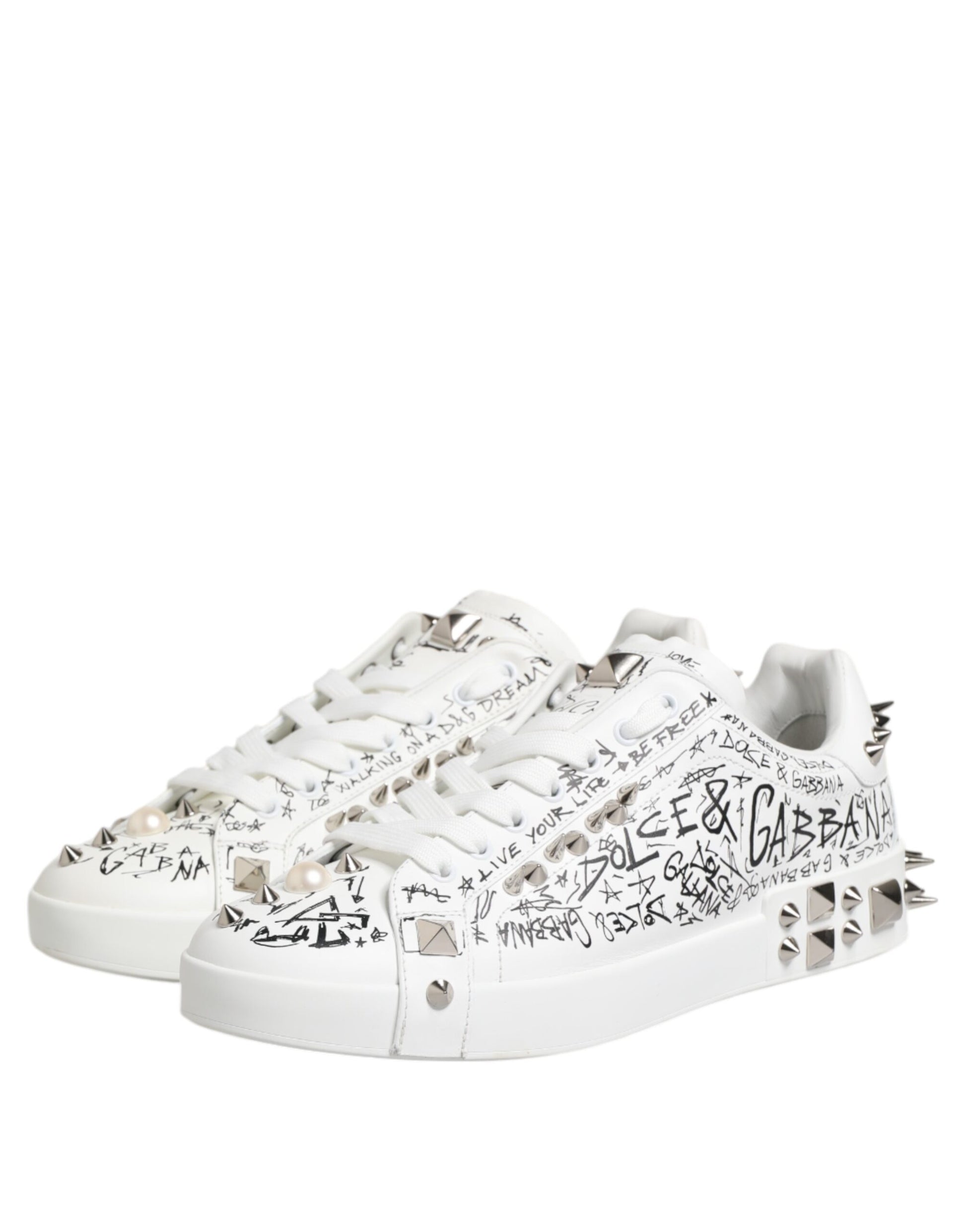 White sneakers with studs, text, and logos on the side