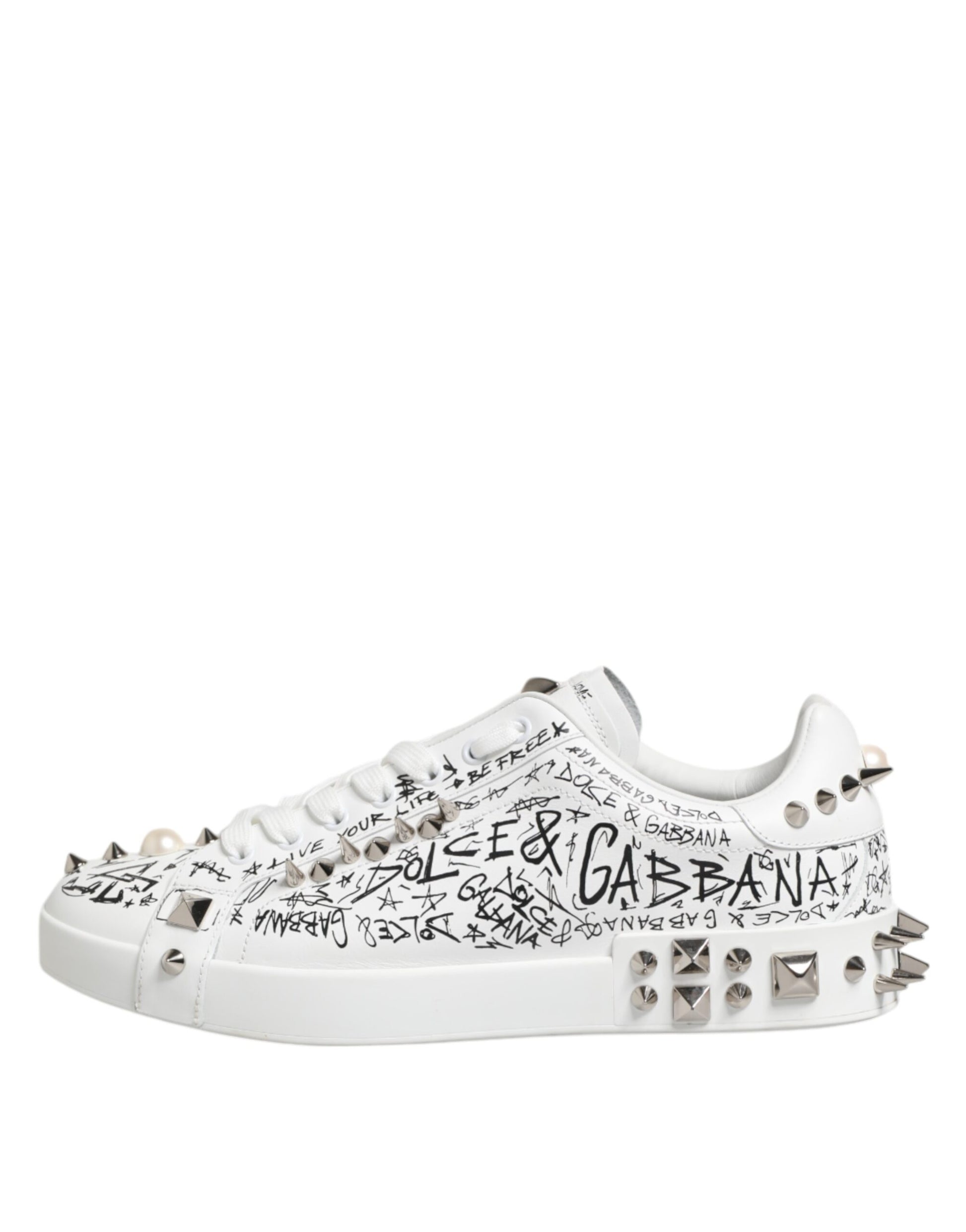 White sneakers with studs, text, and spikes on the sides