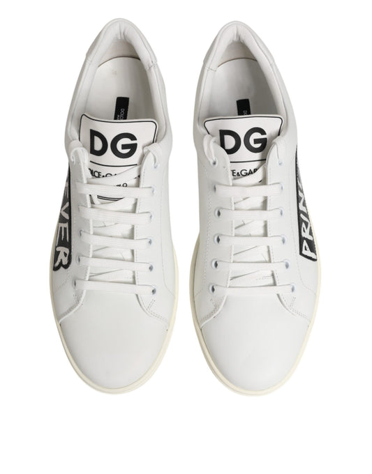 Pair of white sneakers with black laces and brand logo on side