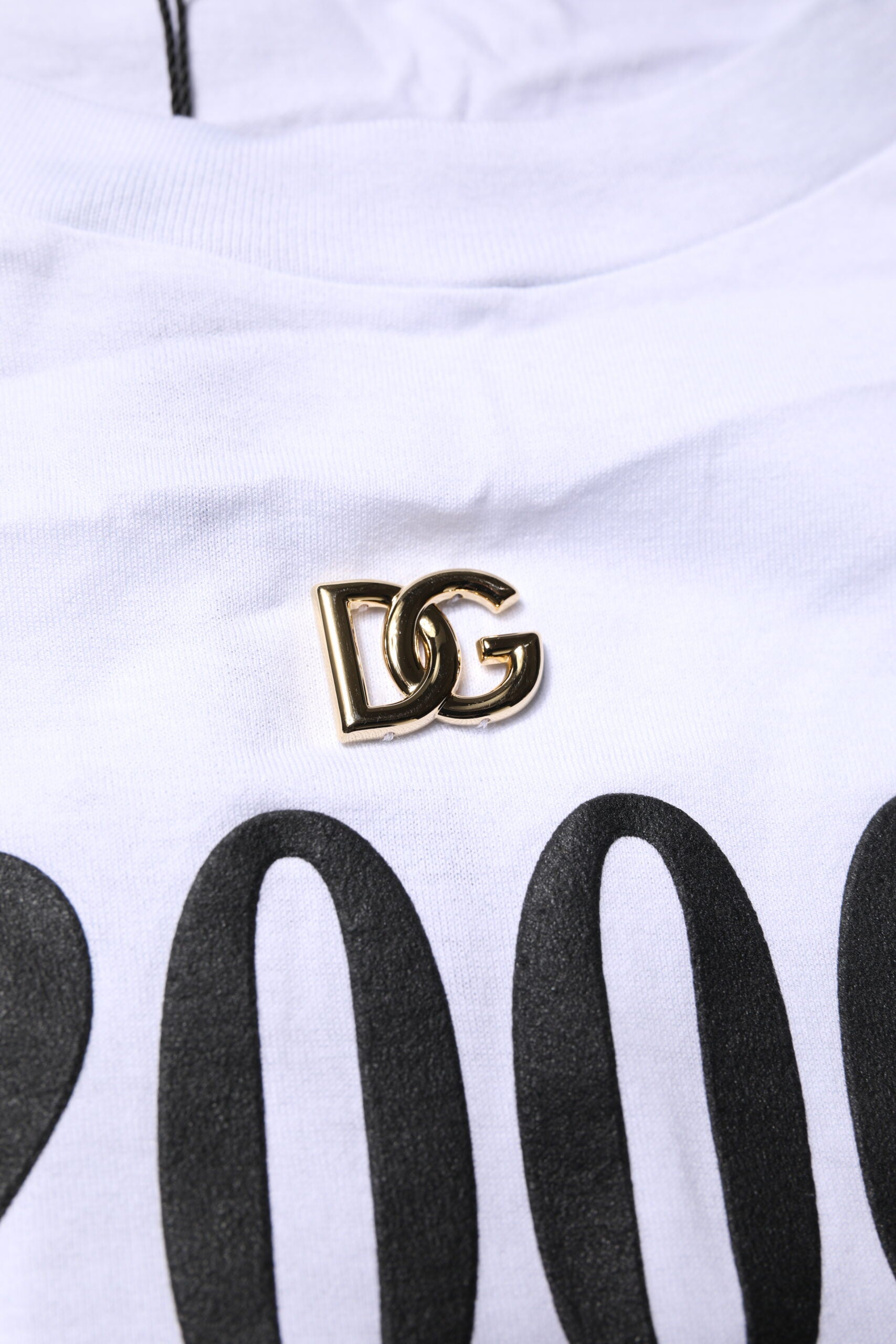 Gold DG logo on white shirt