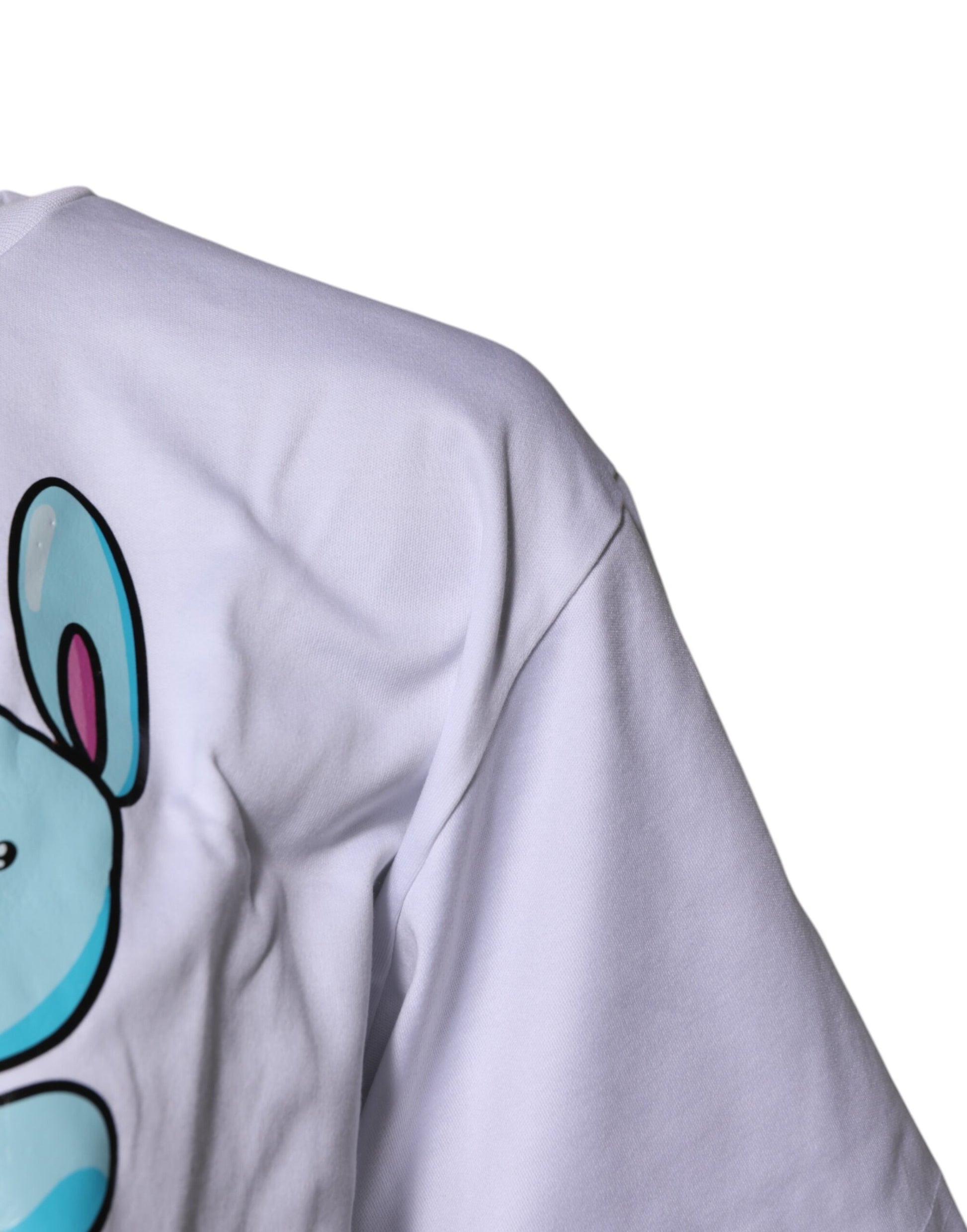 White t-shirt with blue cartoon character on front