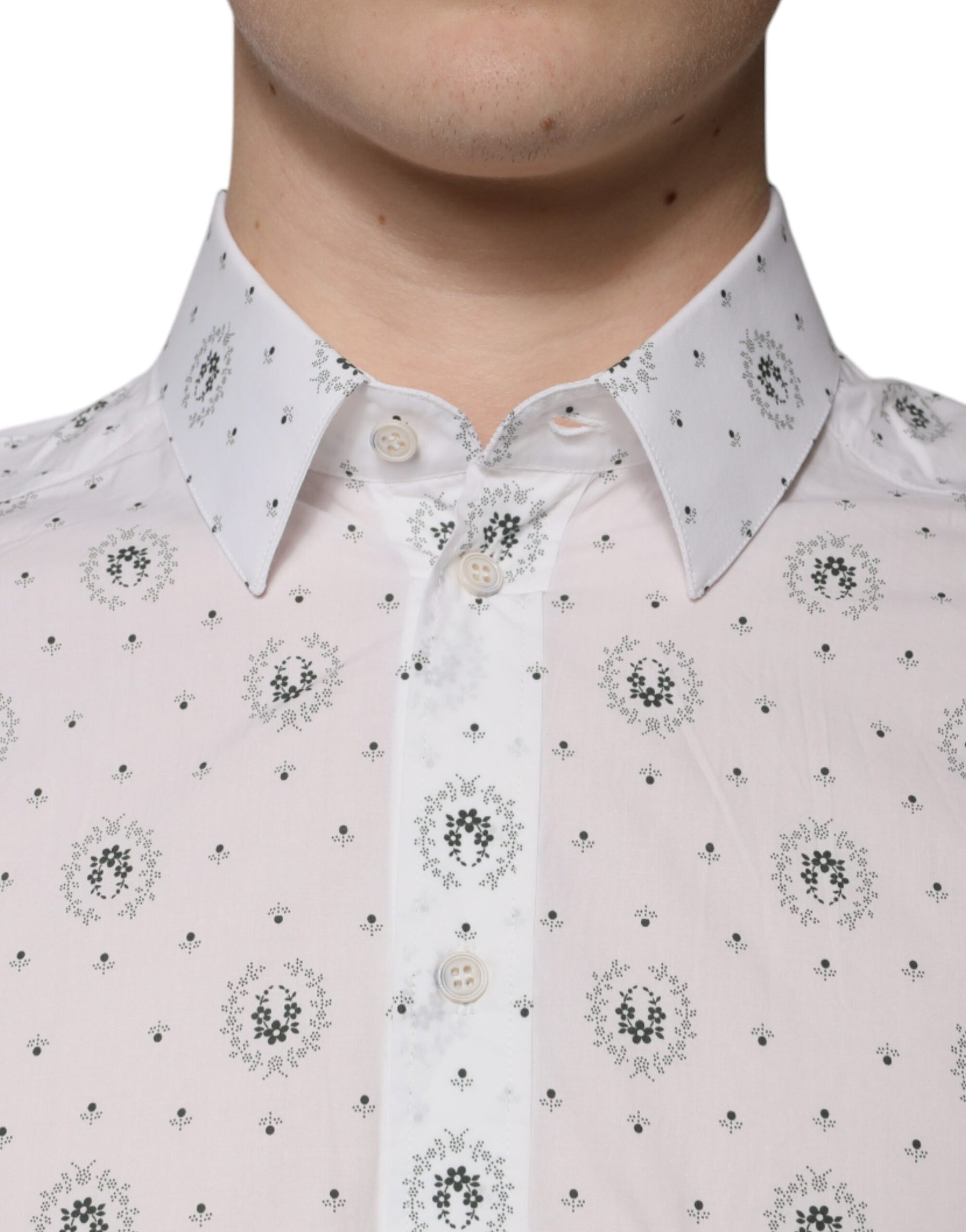 A slim fit men's dress shirt with a white background and black floral print