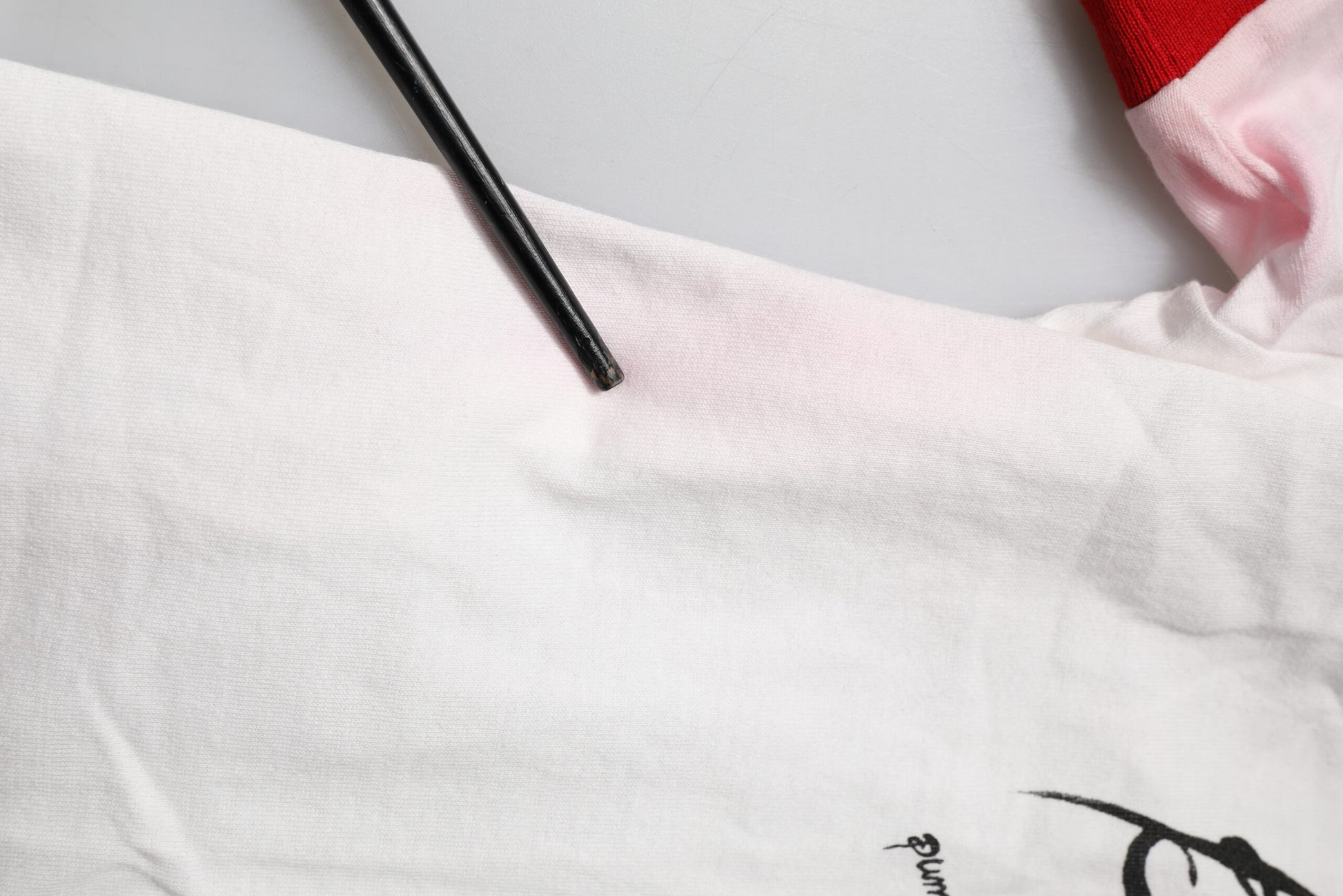 Black pen on white cloth