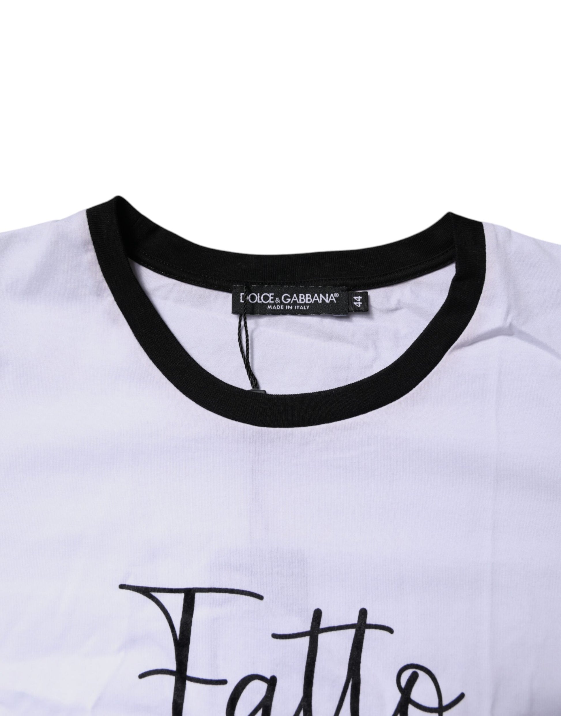 White t-shirt with black collar and handwritten style lettering on front