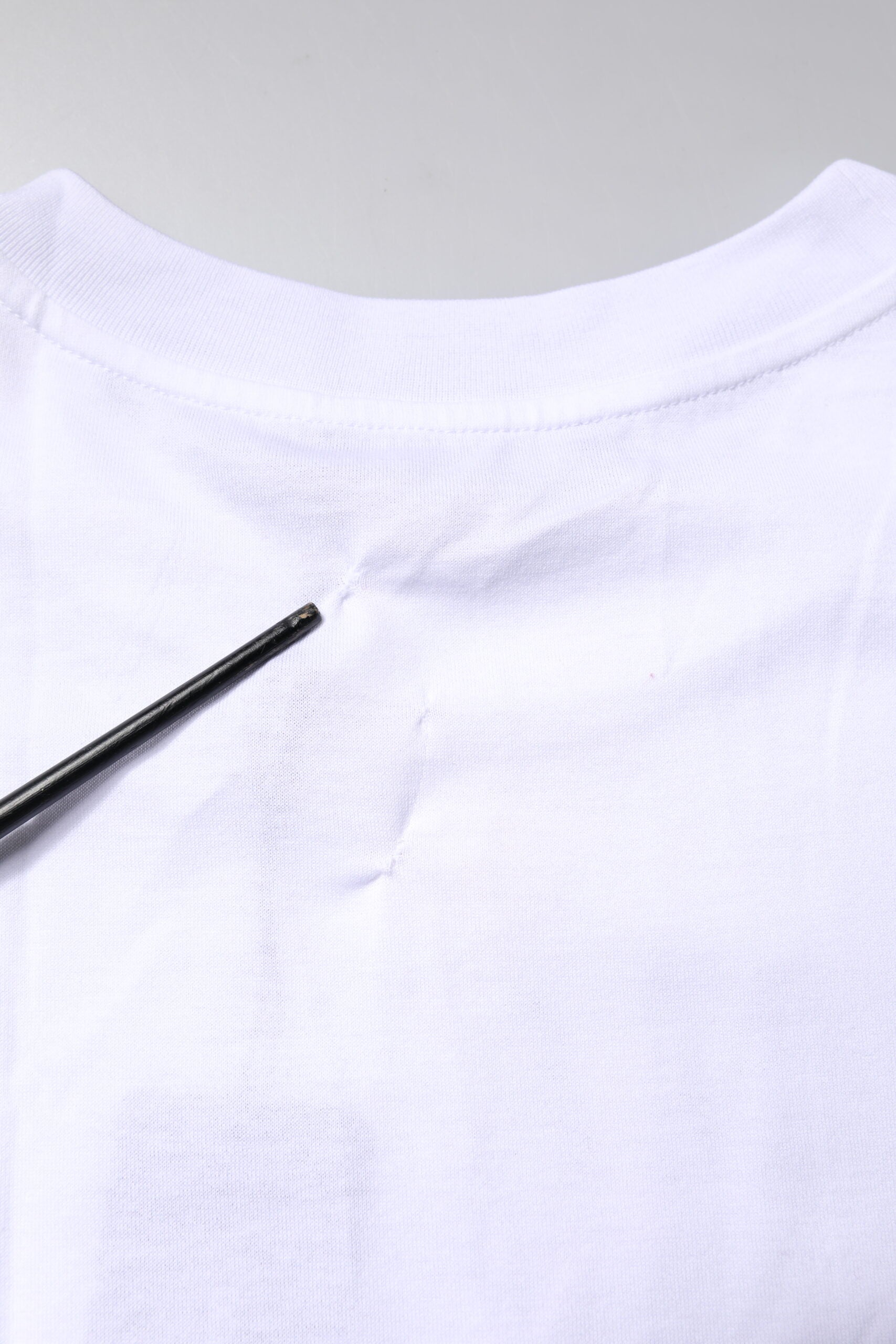 White t-shirt on hanger