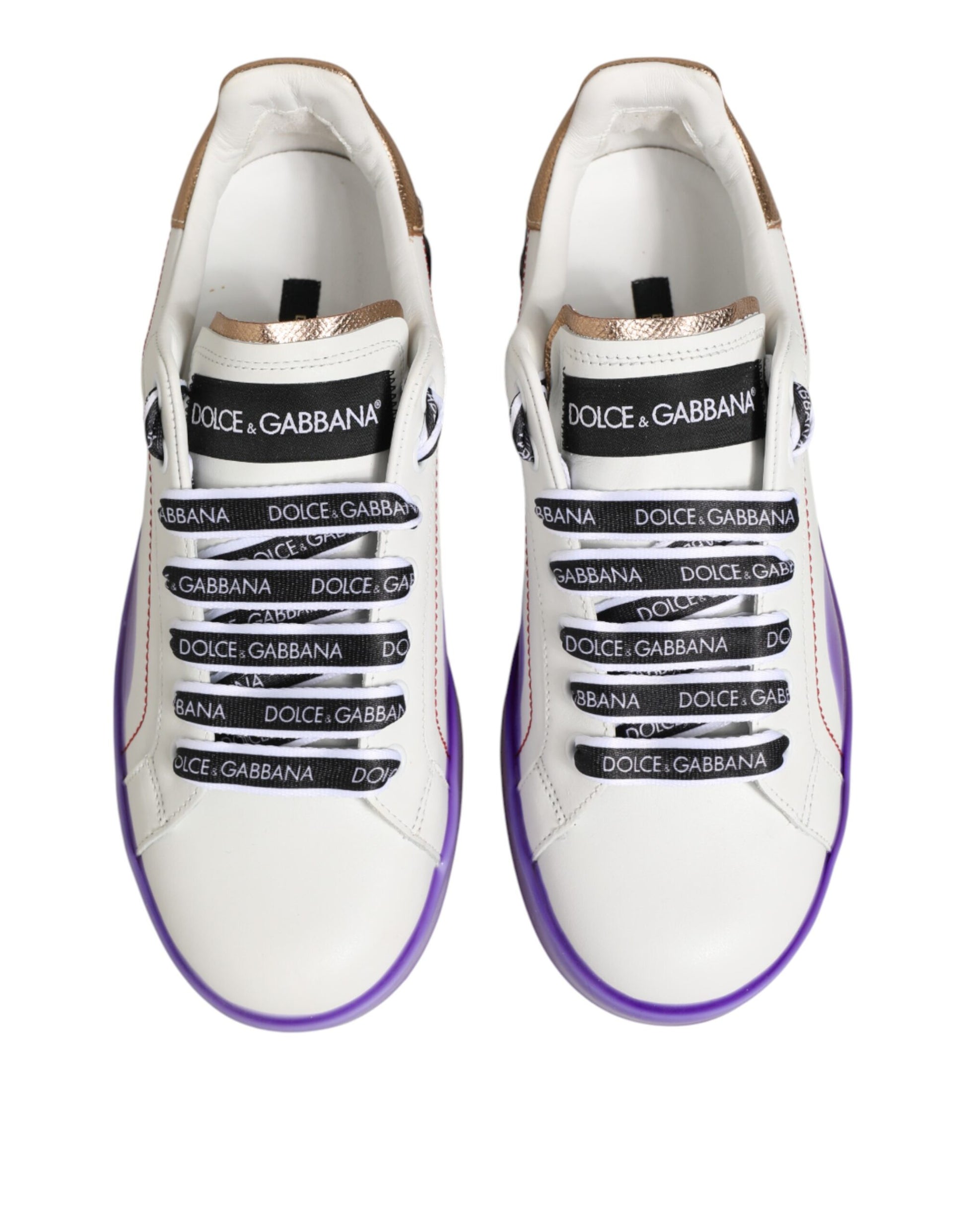 Pair of white and purple leather sneakers with black laces, branded with "Dolce & Gabbana" text