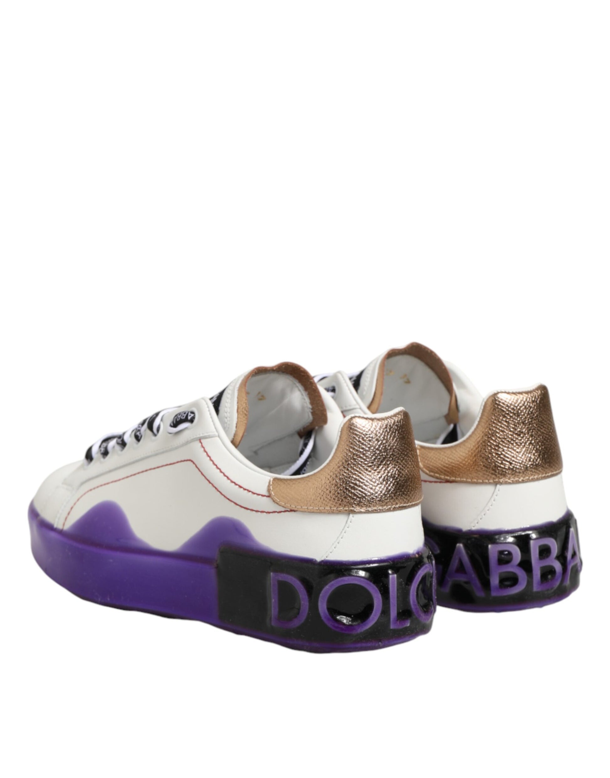 A pair of white and purple leather sneakers with gold accents, featuring the Dolce & Gabbana logo