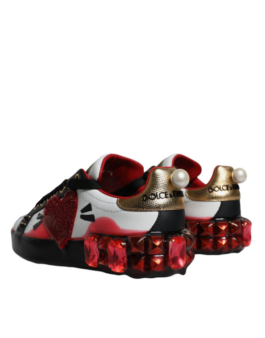 Red and white baby shoes with gold accents