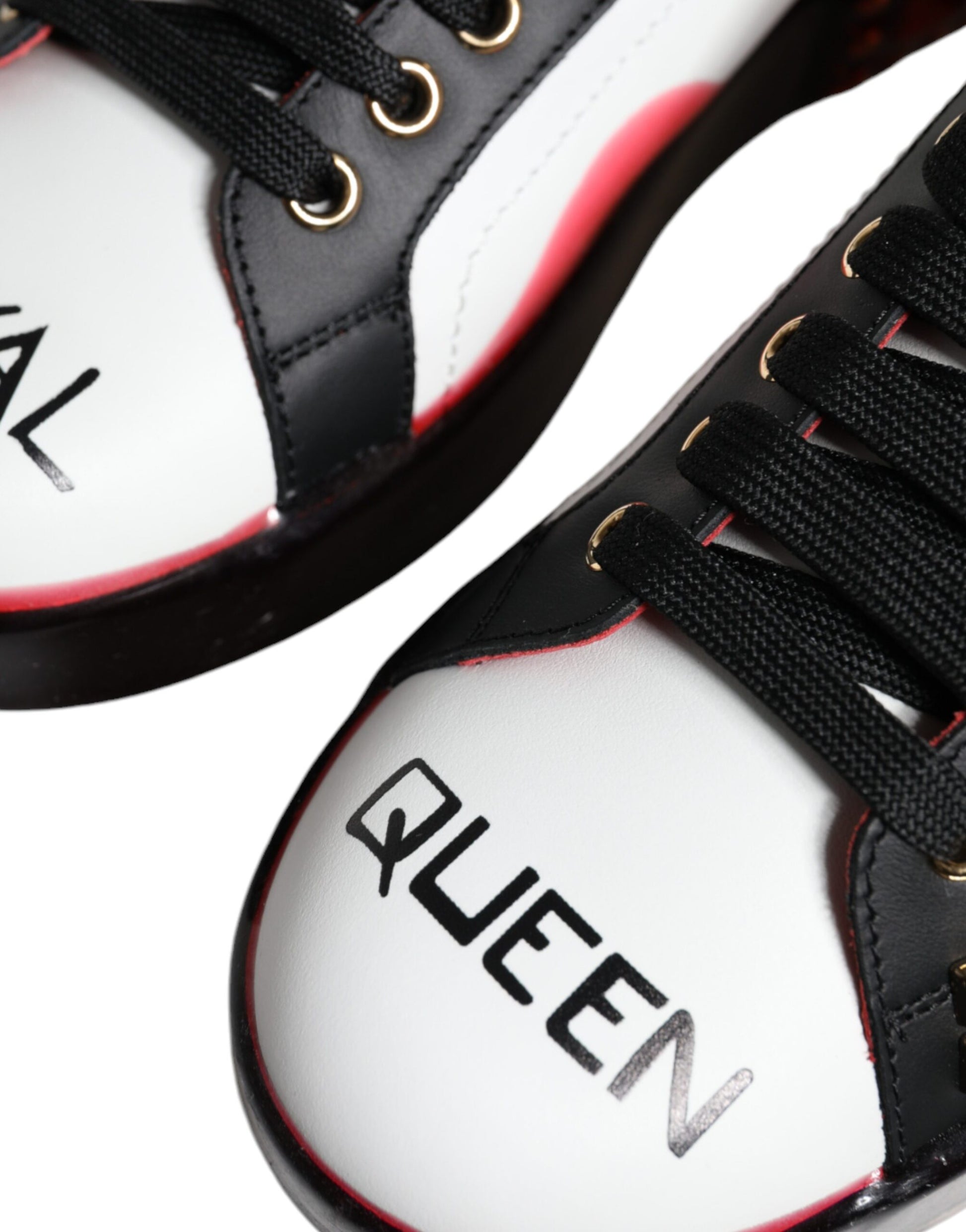 Pair of sneakers with red and black design featuring the word QUEEN in white letters on side