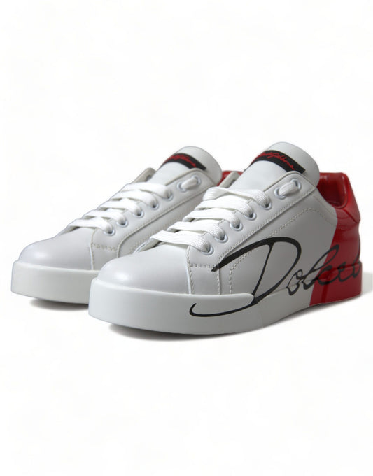 Pair of white sneakers with red accents and black laces