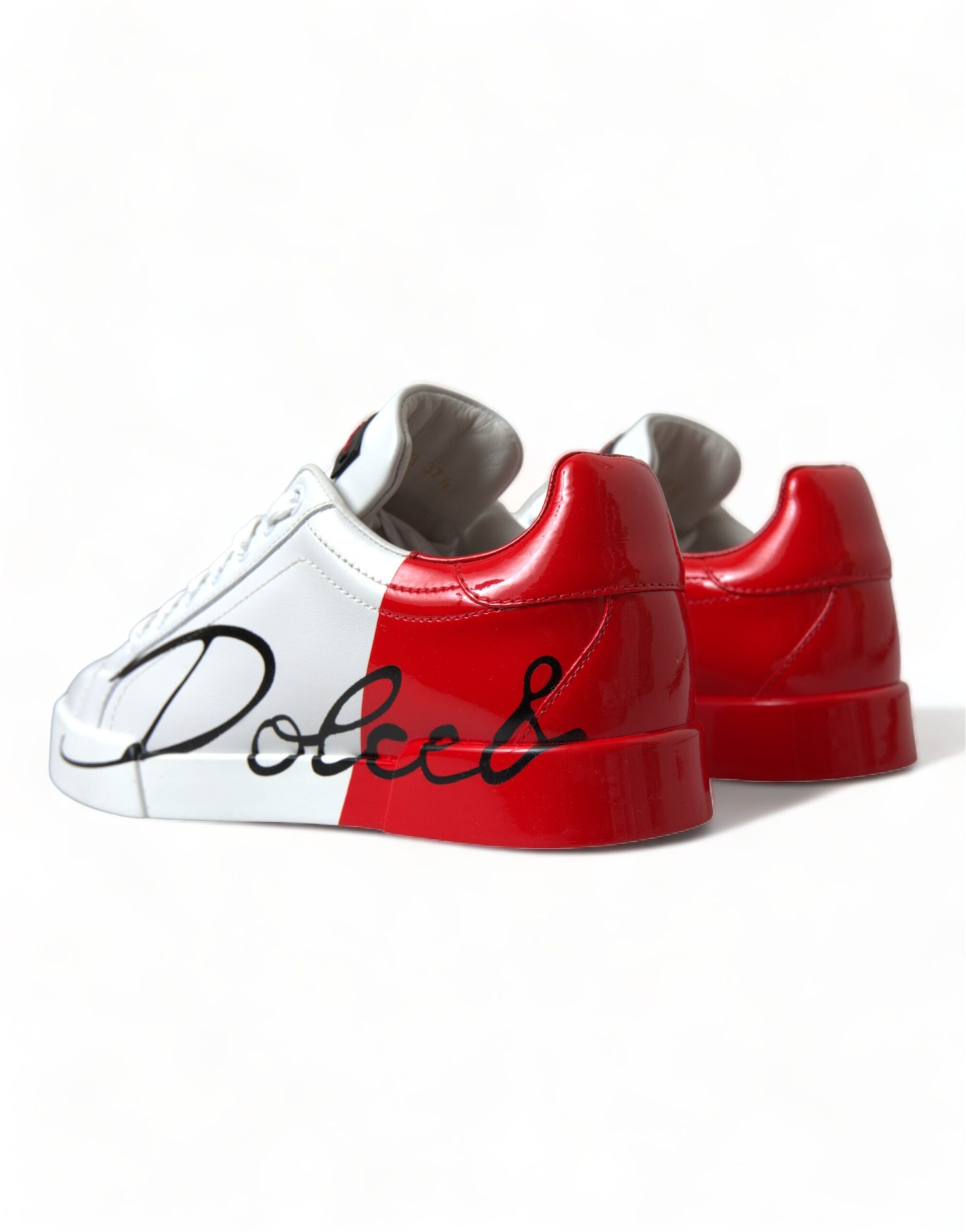 Pair of red and white sneakers with black laces