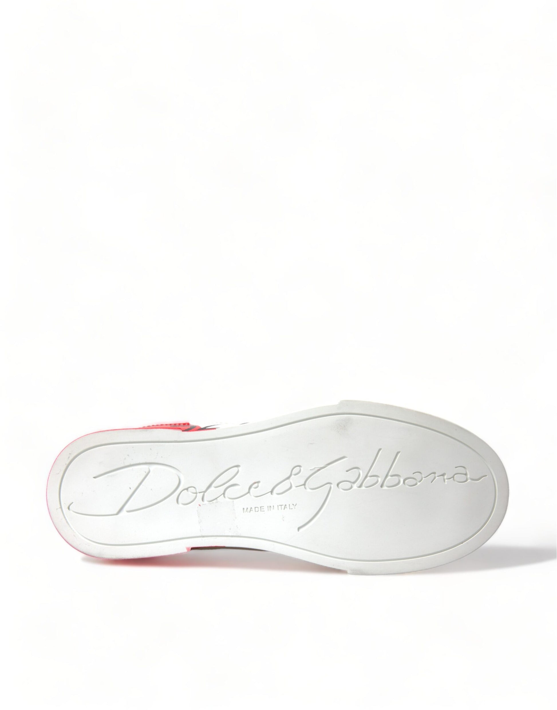 White and red shoe with a signature on it