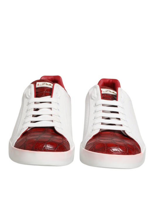Pair of red and white leather sneakers with laces, featuring a crocodile skin design on the toe