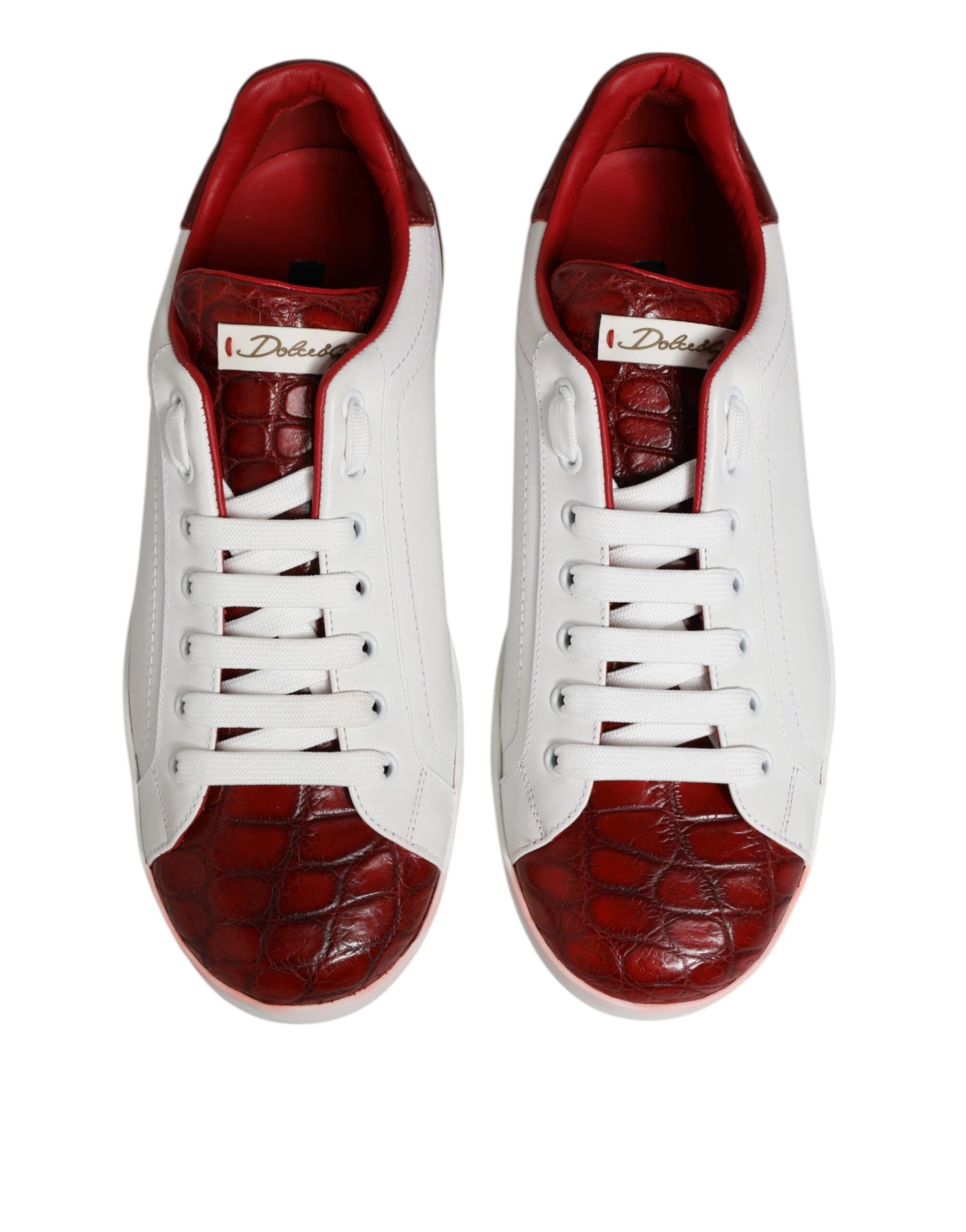 Pair of white red leather lace up sneakers shoes with gold accents