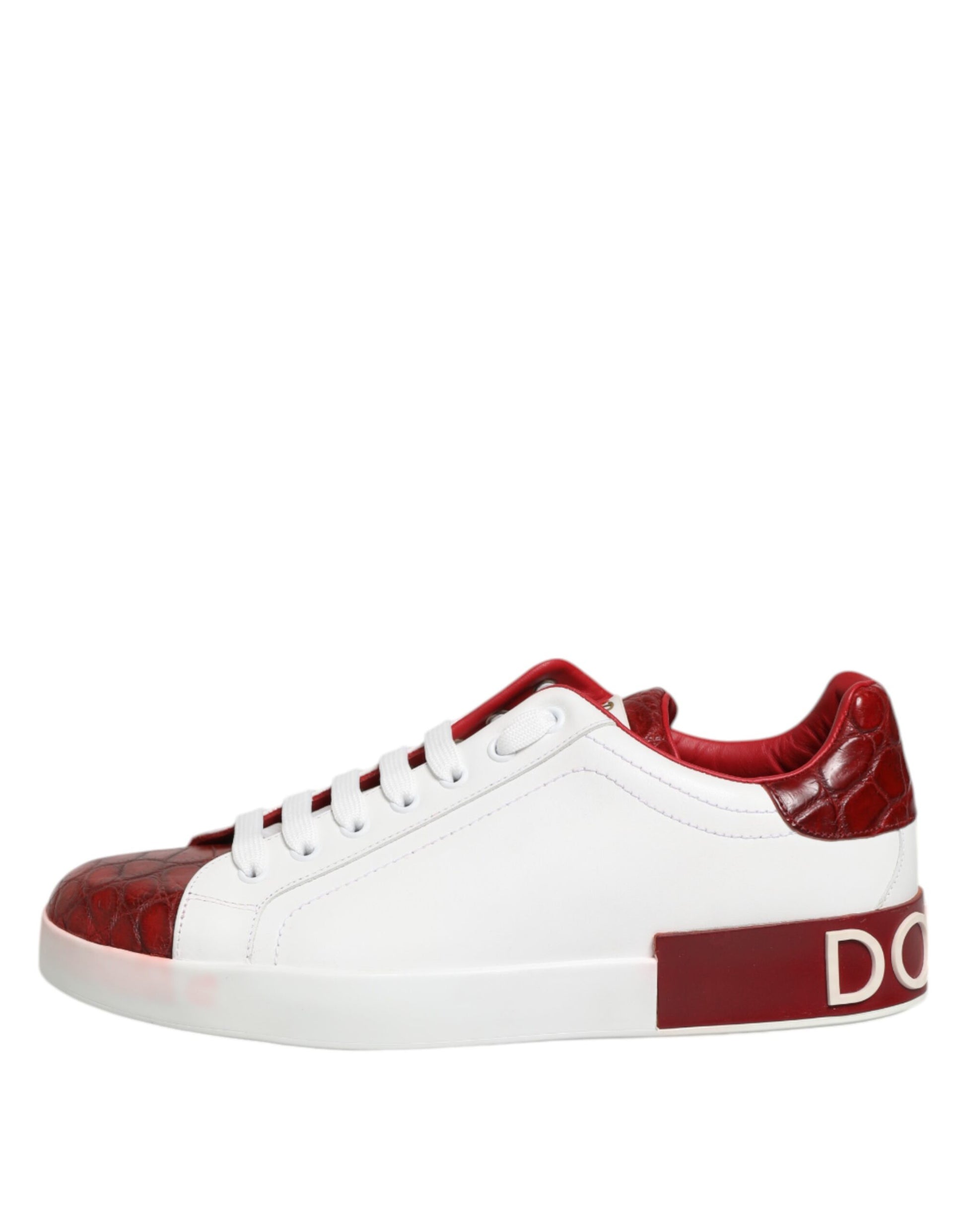 A pair of red and white leather sneakers with laces, featuring a logo on the side
