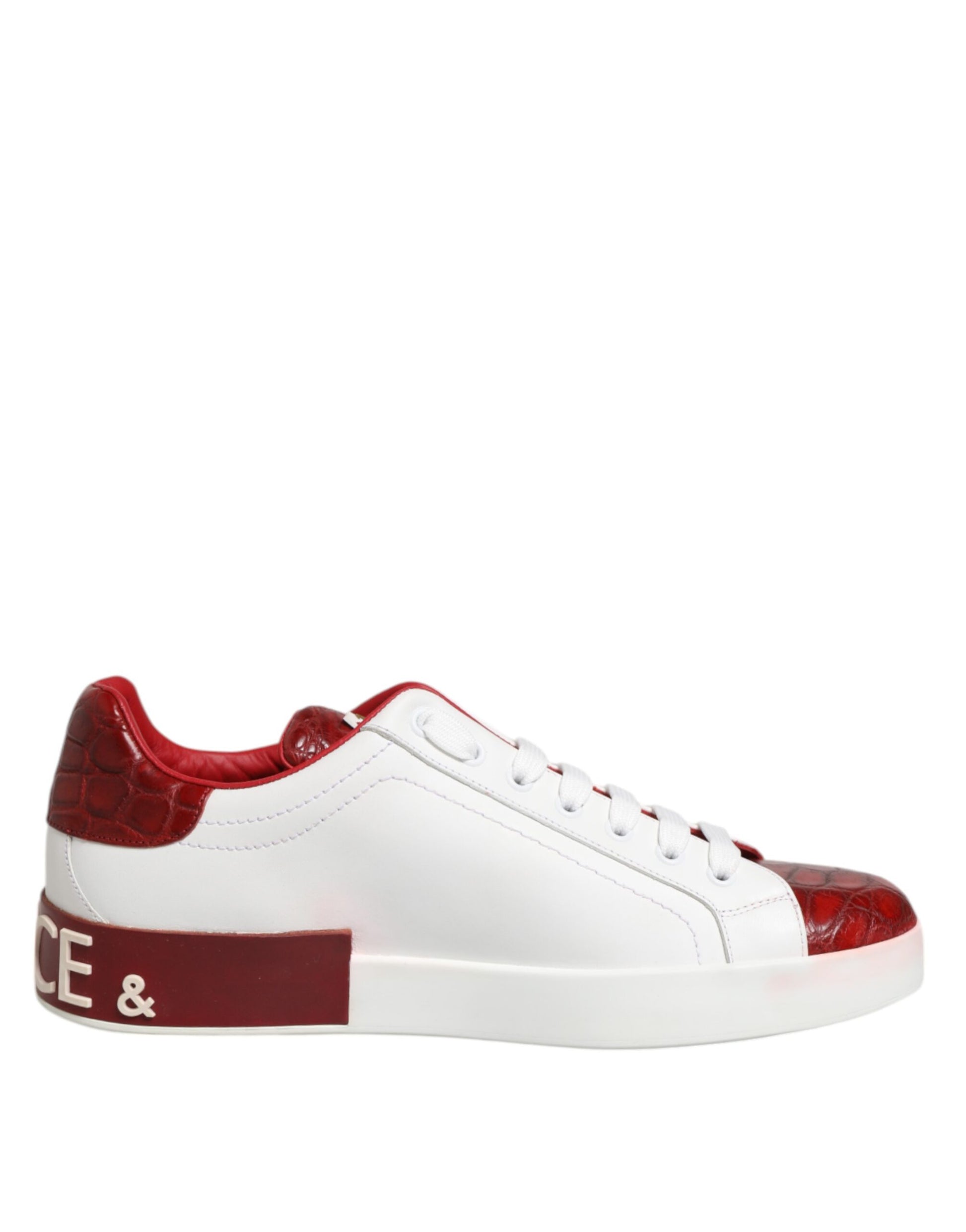 A pair of red and white leather sneakers with laces, featuring the brand name "Dolce & Gabbana" on the side