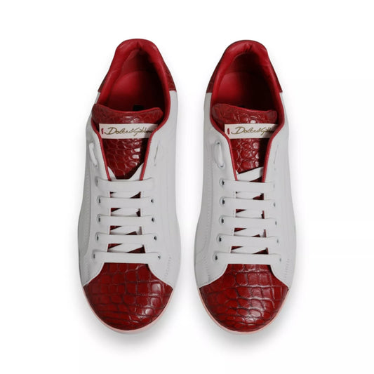 Pair of red and white leather sneakers with a logo on the side, featuring a lace-up design