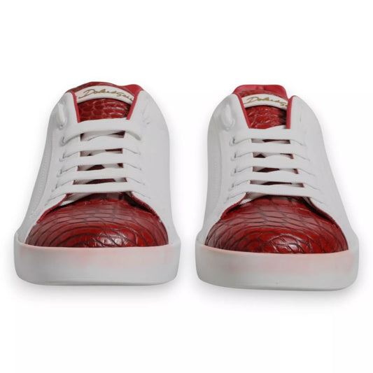 A pair of red and white sneakers with a leather logo on the side