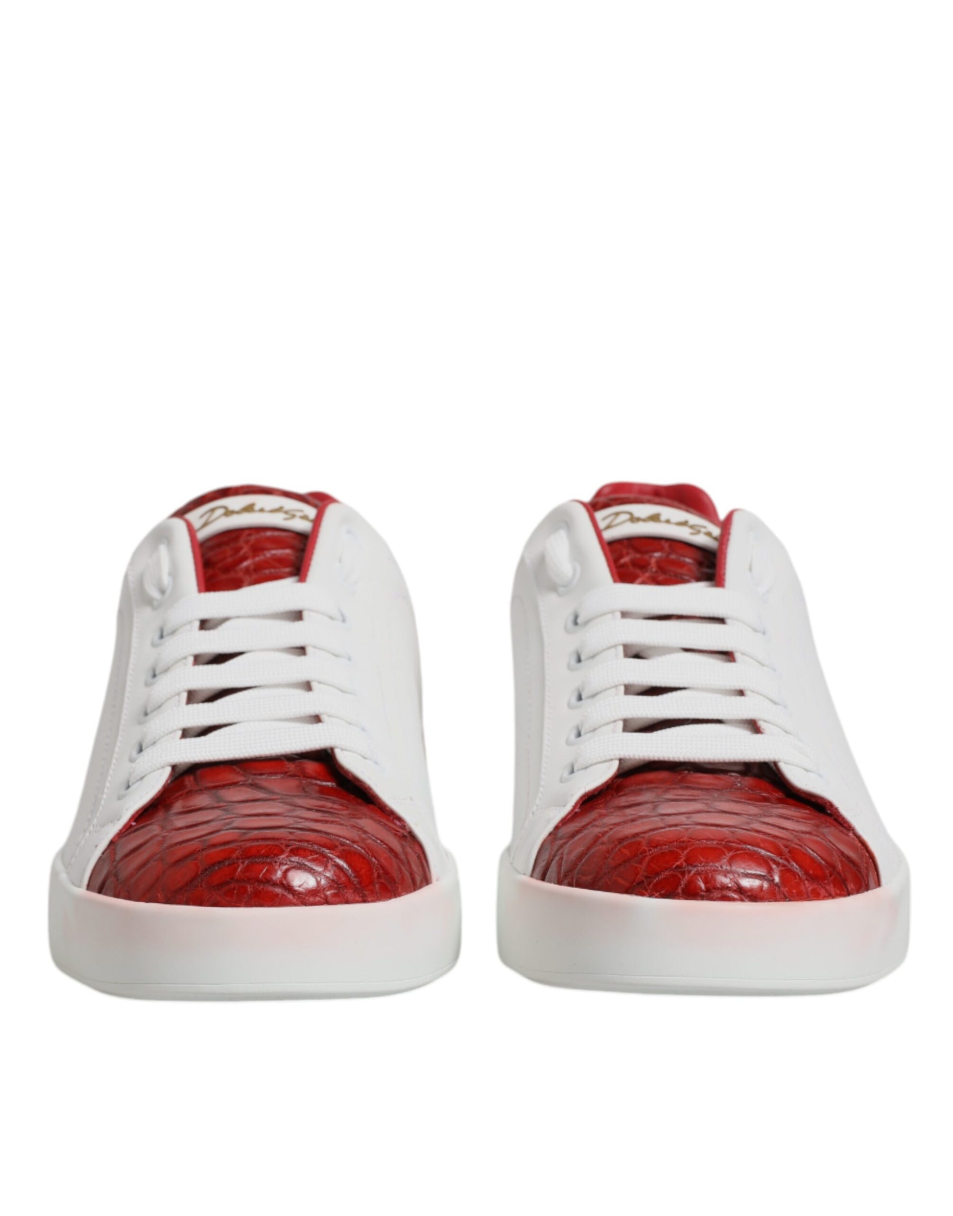 Pair of red and white leather sneakers with a crocodile skin texture