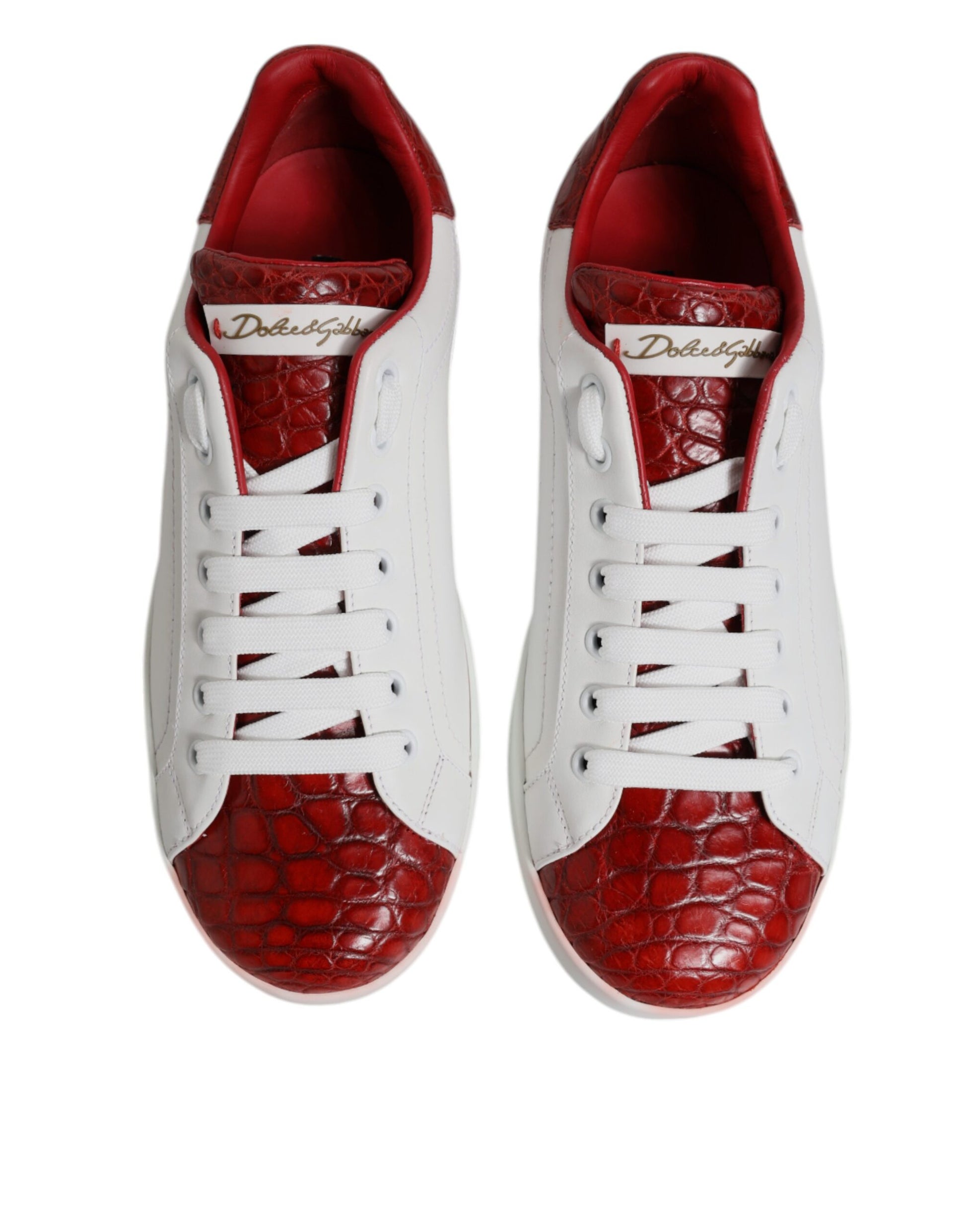Pair of red and white leather sneakers with laces, featuring a crocodile skin texture on the toe box
