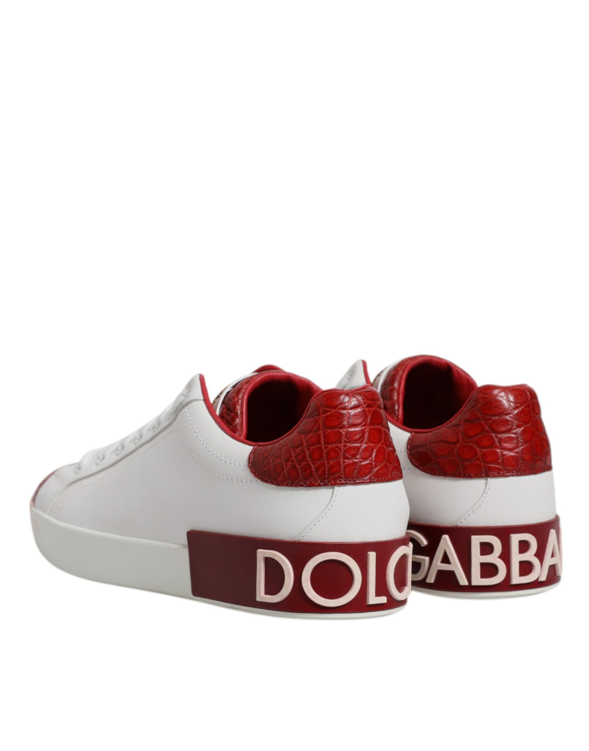 A pair of red and white leather sneakers with the Dolce & Gabbana logo