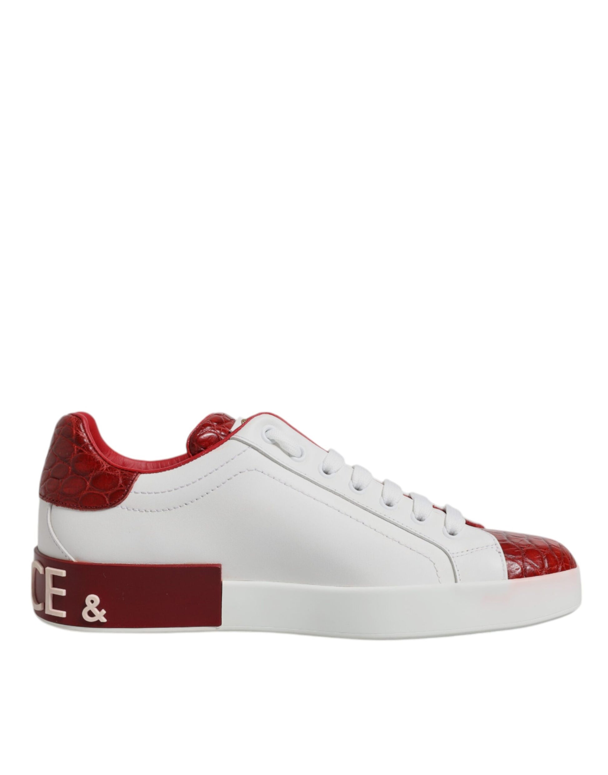 A pair of red and white leather sneakers with a logo on the side, designed by Dolce & Gabbana
