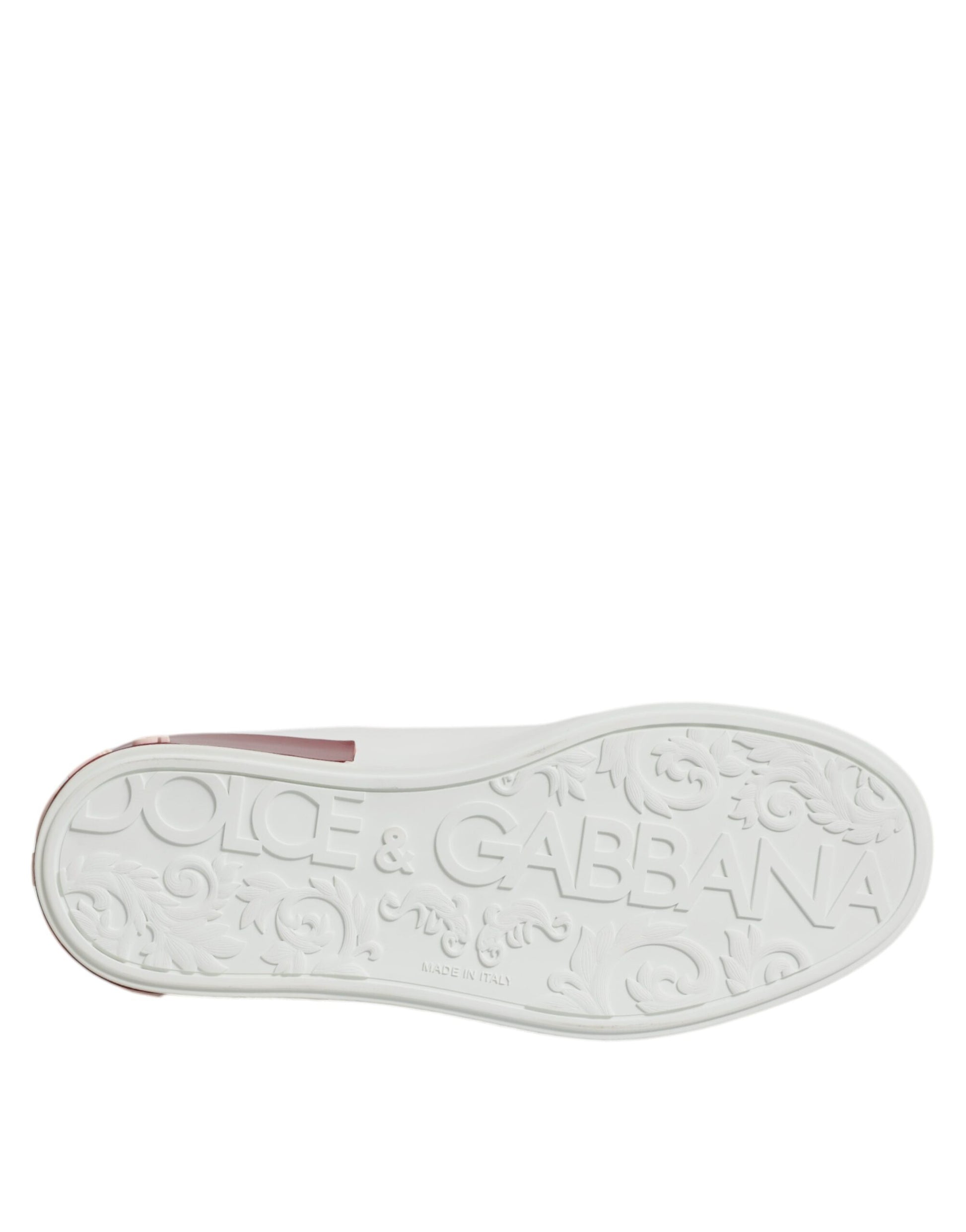 A white and red leather shoe with a gold buckle, featuring the brand name "Dolce & Gabbana" on the side