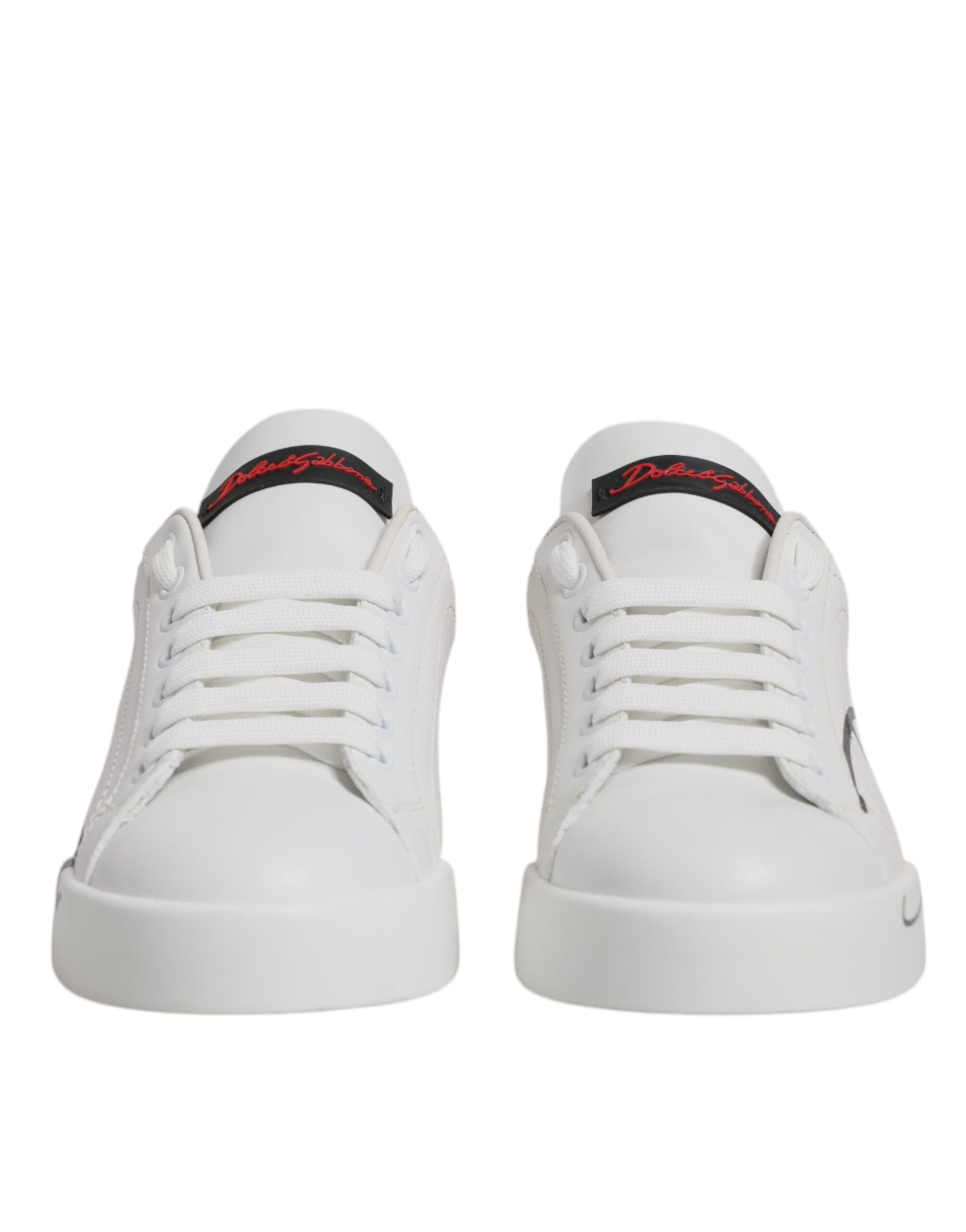 Pair of white sneakers with red logo on side