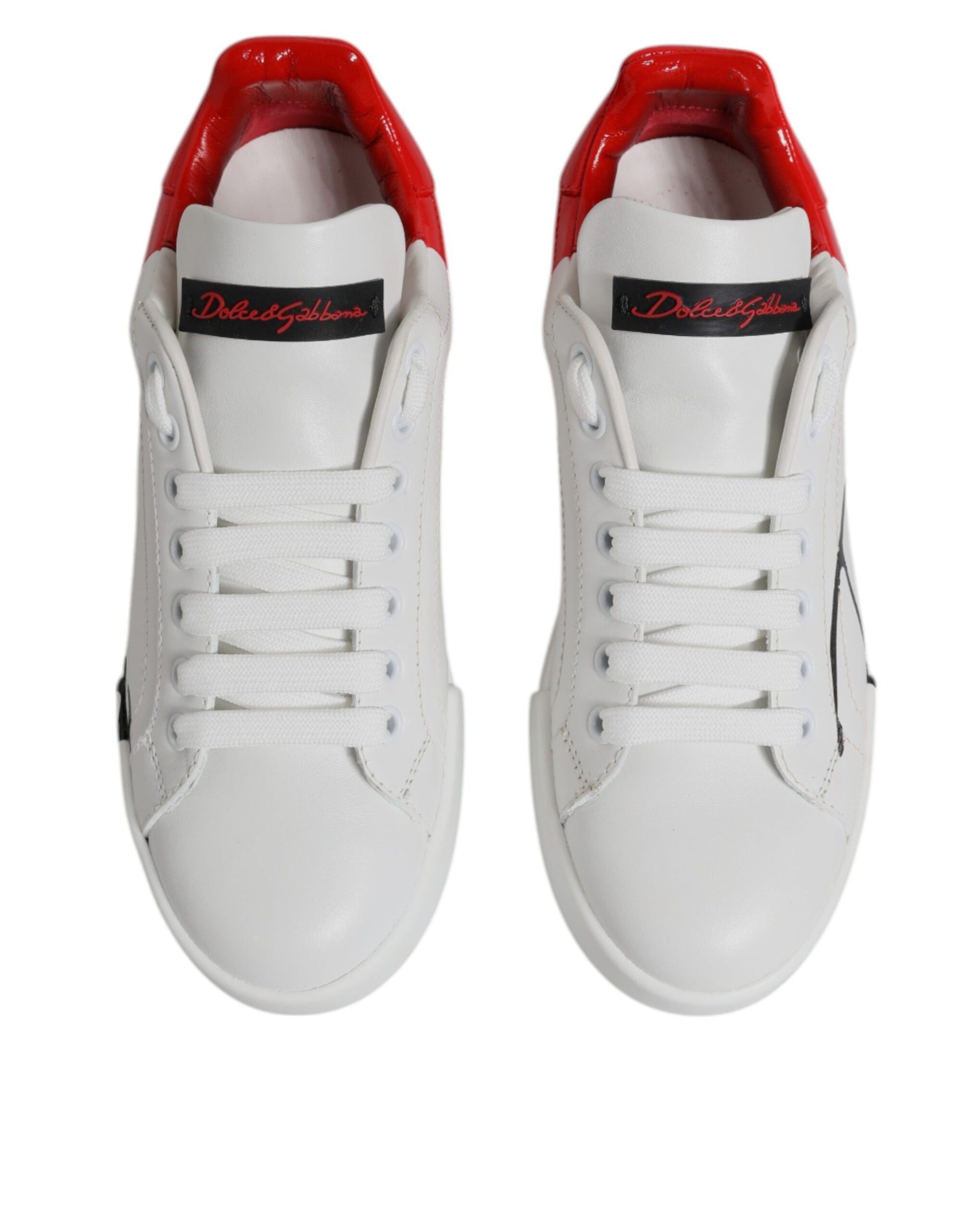Pair of white sneakers with red accents