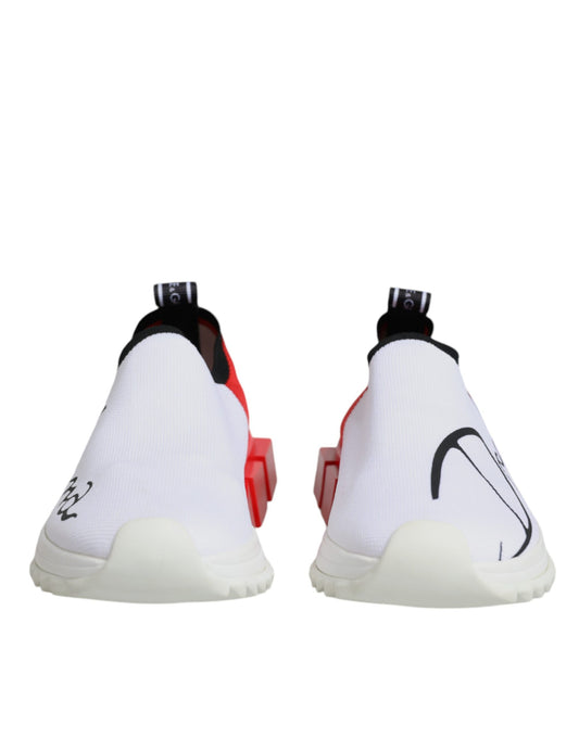 Pair of white and red sneakers with black laces, featuring a low top design