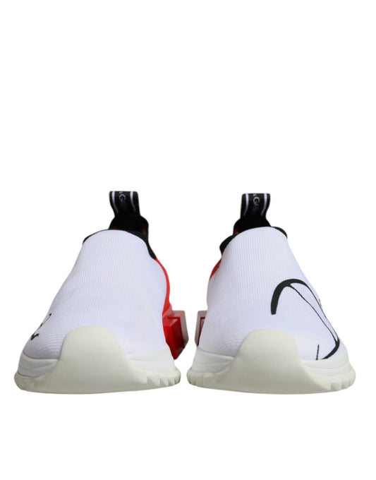Pair of white, red, and black sneakers with laces