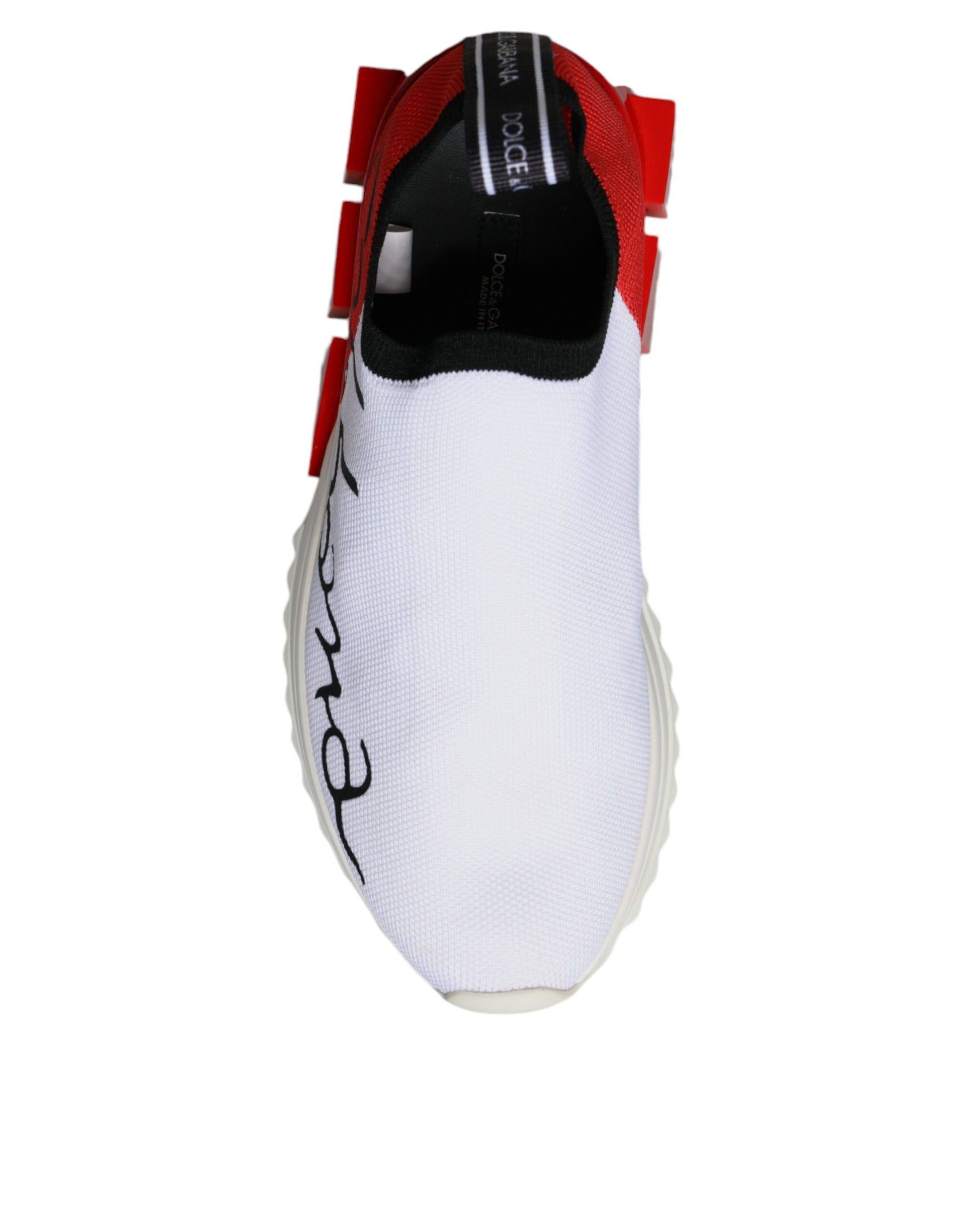 A pair of white red and black sneakers with a low top design, featuring the brand name "Dolce & Gabbana" on the side