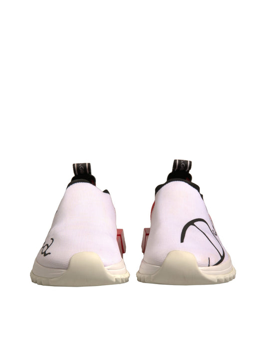 Pair of white sneakers with black laces and red accents