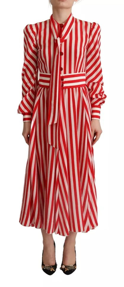 Long red and white striped silk dress with a V-neckline, long sleeves, and a tie at the waist