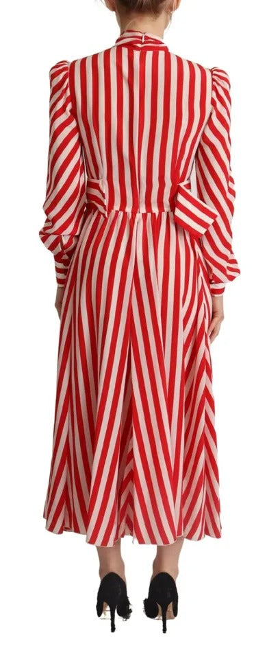 A red and white striped maxi dress with long sleeves