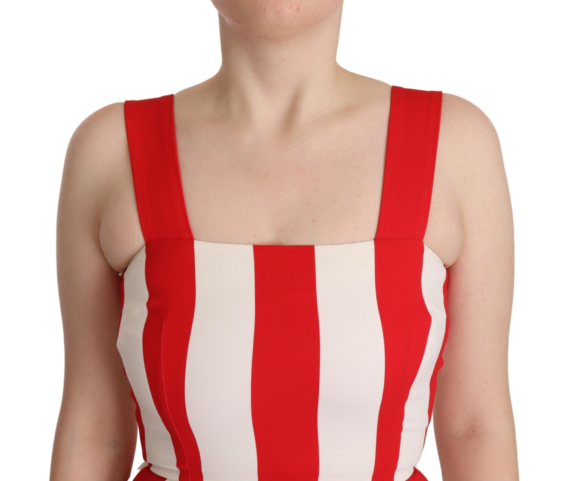 A woman wearing a red and white striped dress with short sleeves