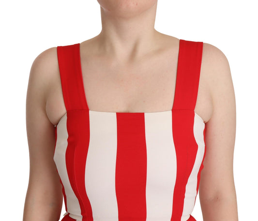 A woman wearing a red and white striped dress with short sleeves