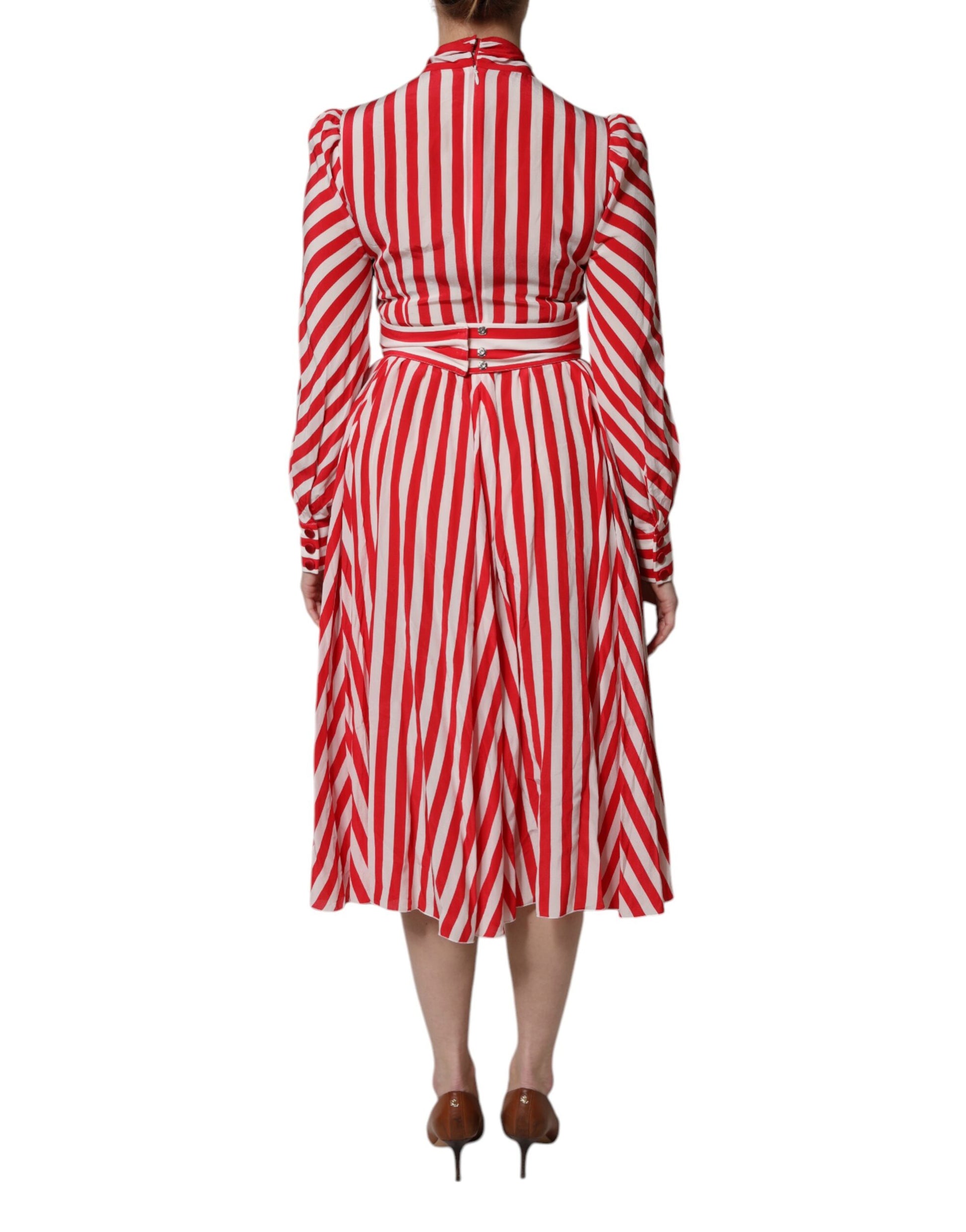 A red and white striped midi dress with long sleeves, designed by Dolce & Gabbana
