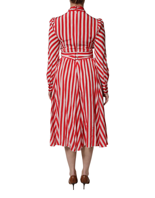 A red and white striped midi dress with long sleeves, designed by Dolce & Gabbana