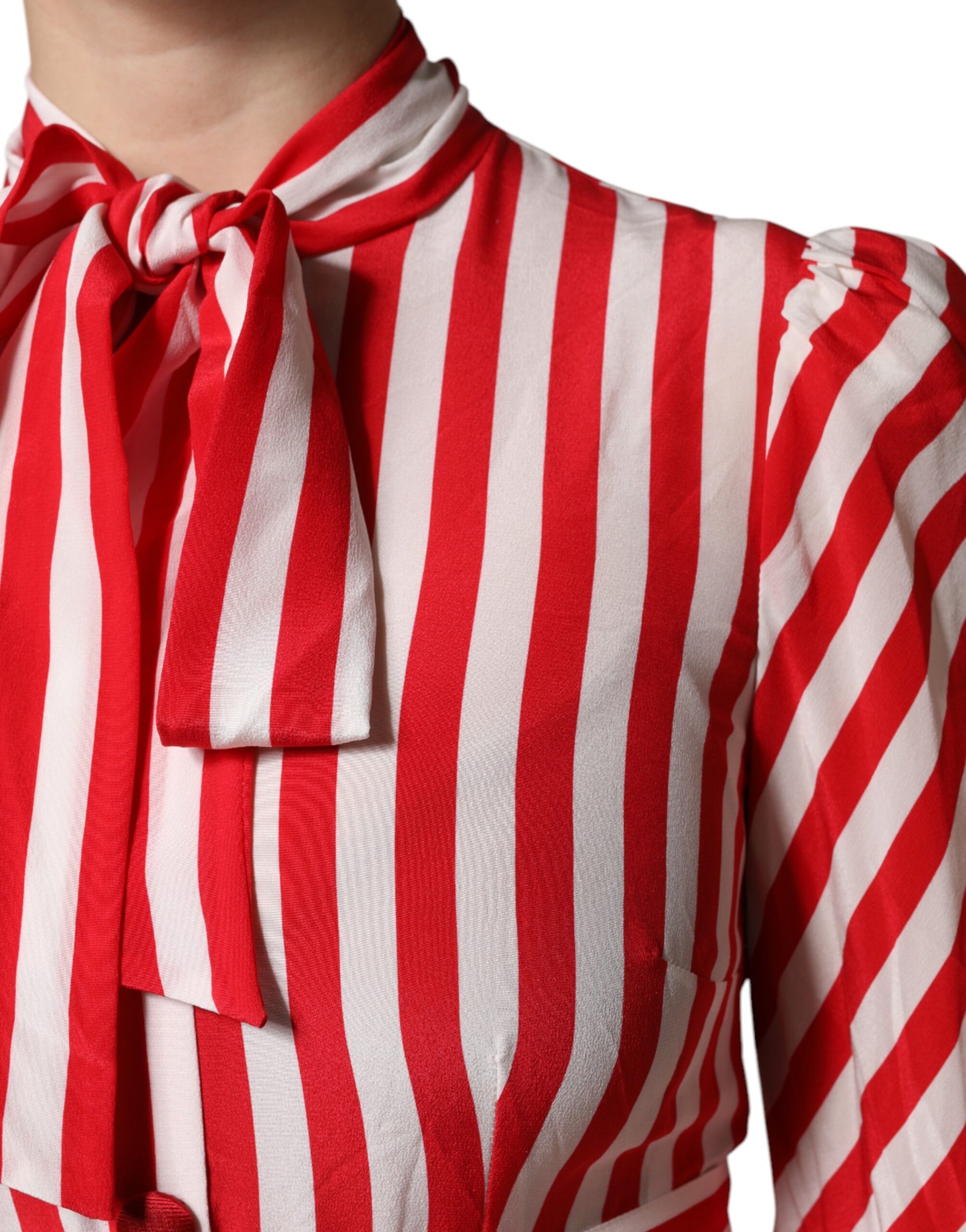 A red and white striped midi dress with long sleeves